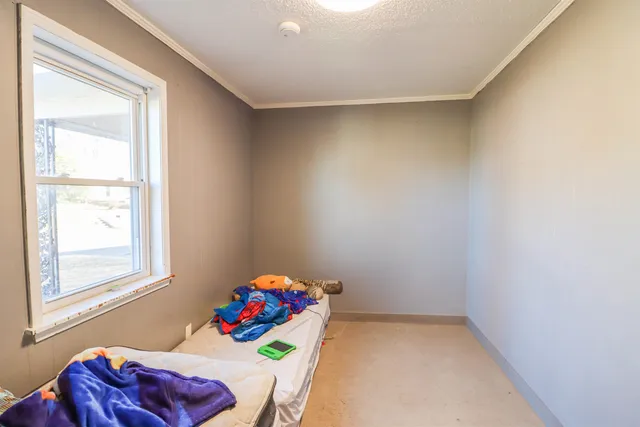 a kids room with toys and a window