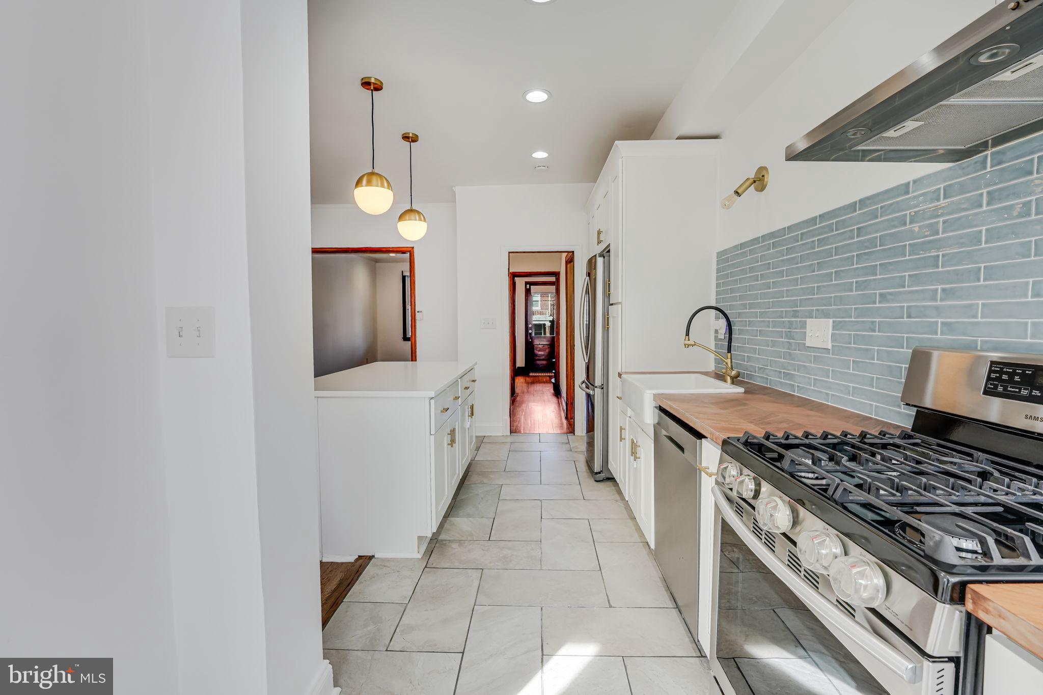 1304 Rittenhouse Street Northwest Washington, DC 20011 - Photo 18 of 50 a kitchen with a stove and a sink