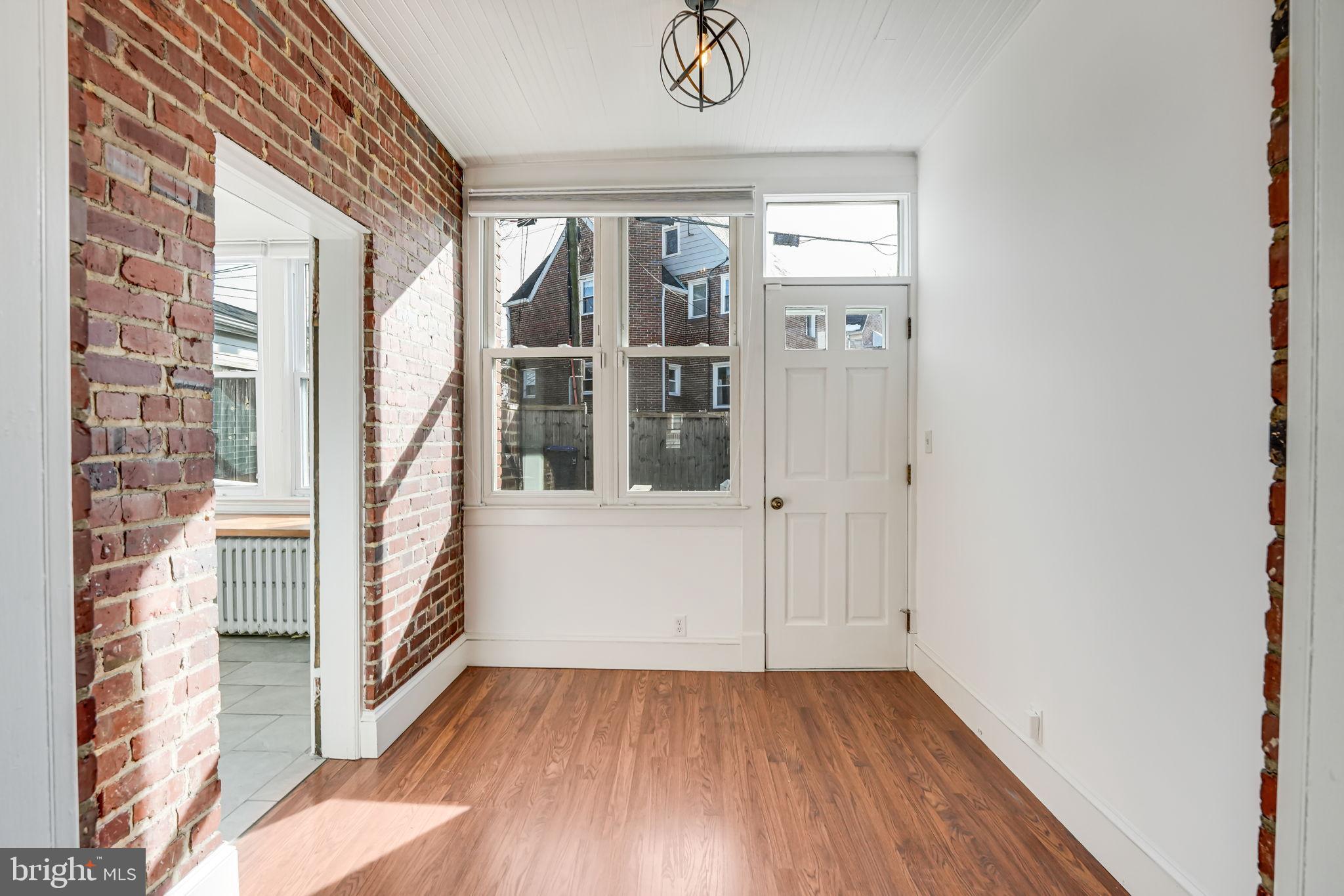 1304 Rittenhouse Street Northwest Washington, DC 20011 - Photo 20 of 50 a view of a hallway with wooden floor and entryway