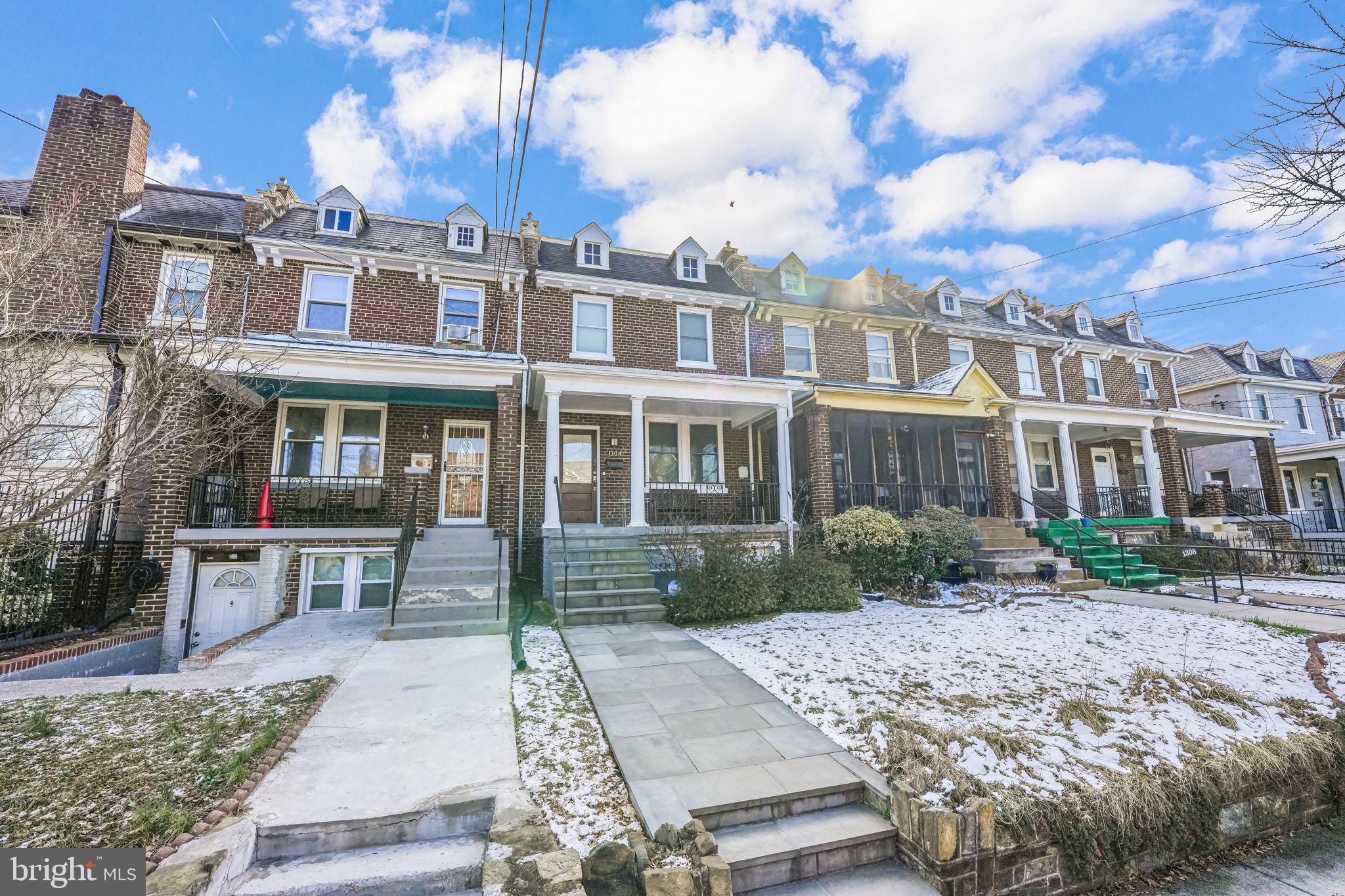 1304 Rittenhouse Street Northwest Washington, DC 20011 - Photo 2 of 50 a view of a brick building next to a yard