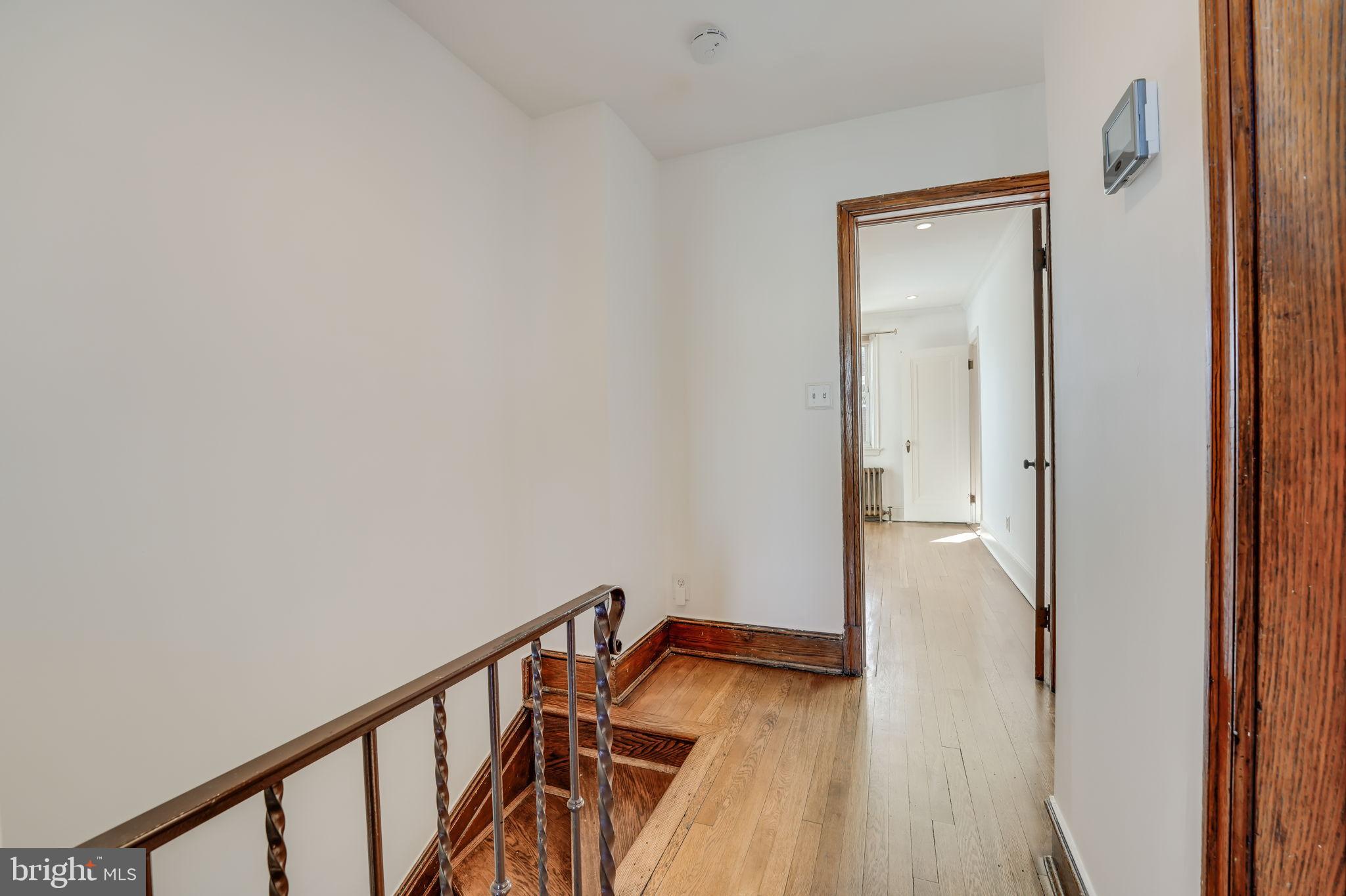 1304 Rittenhouse Street Northwest Washington, DC 20011 - Photo 23 of 50 a view of a hallway with wooden floor and staircase
