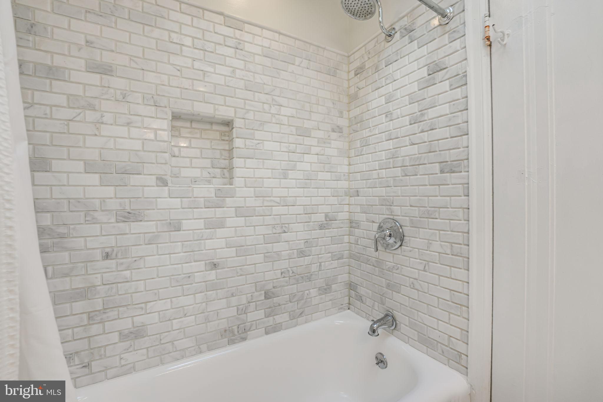 1304 Rittenhouse Street Northwest Washington, DC 20011 - Photo 25 of 50 a bathroom with a bathtub