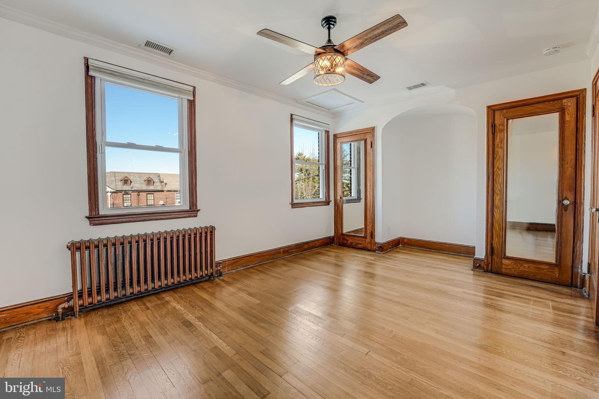 1304 Rittenhouse Street Northwest Washington, DC 20011 - Photo 29 of 50 a view of an empty room with window and wooden floor