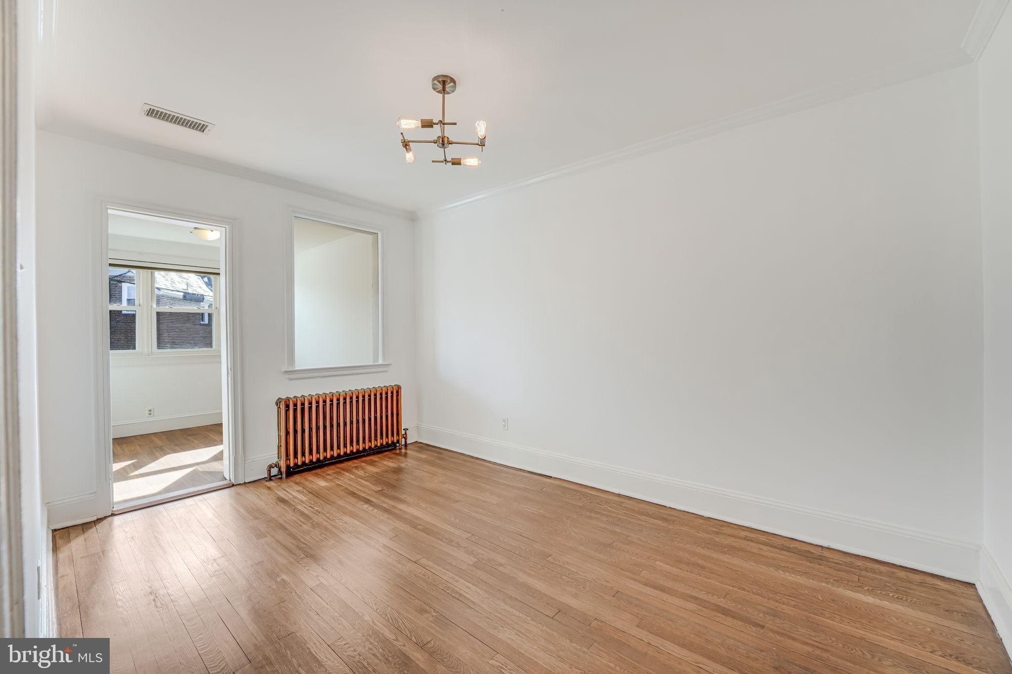 1304 Rittenhouse Street Northwest Washington, DC 20011 - Photo 34 of 50 a view of empty room with wooden floor