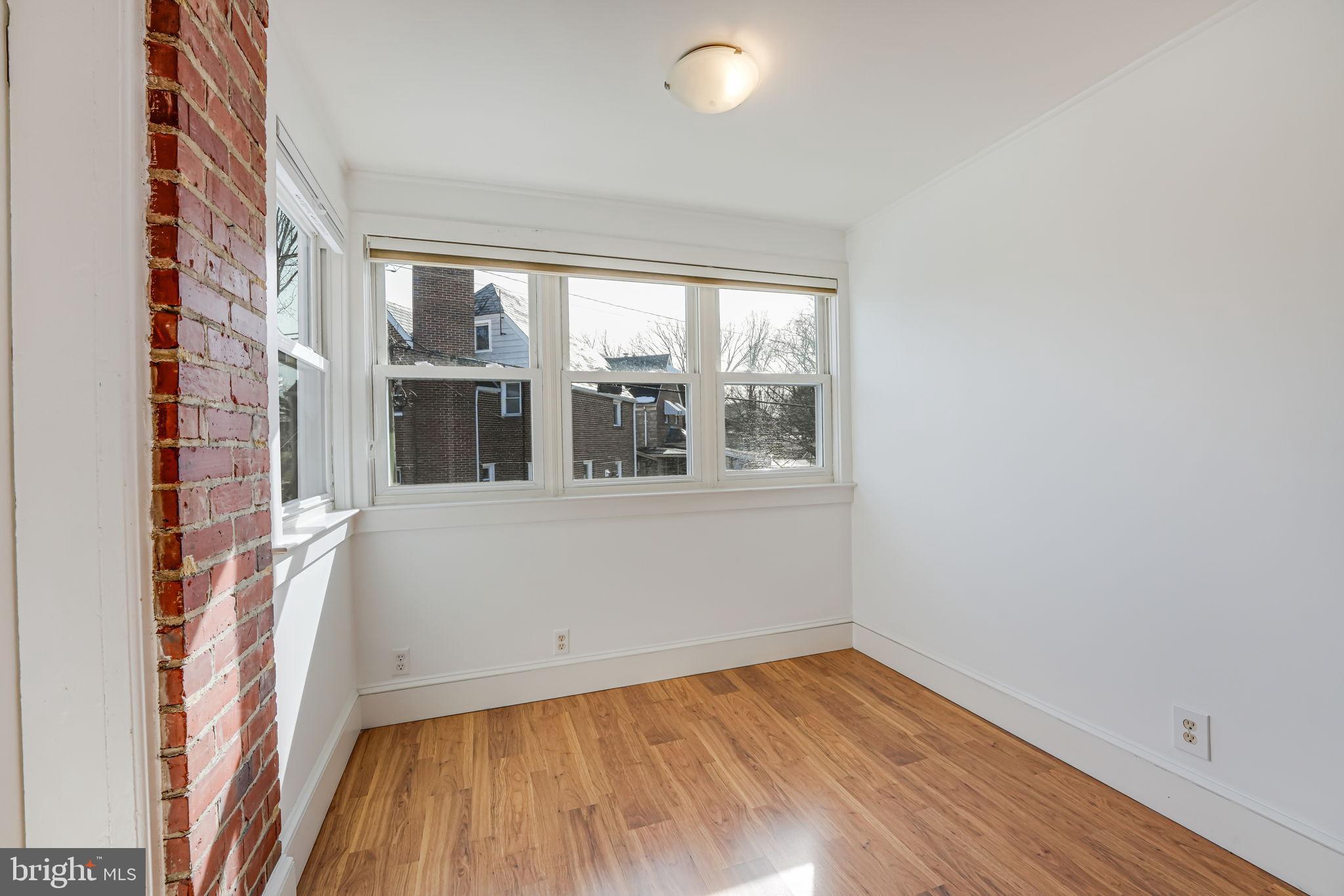 1304 Rittenhouse Street Northwest Washington, DC 20011 - Photo 36 of 50 a view of empty room with wooden floor and fan