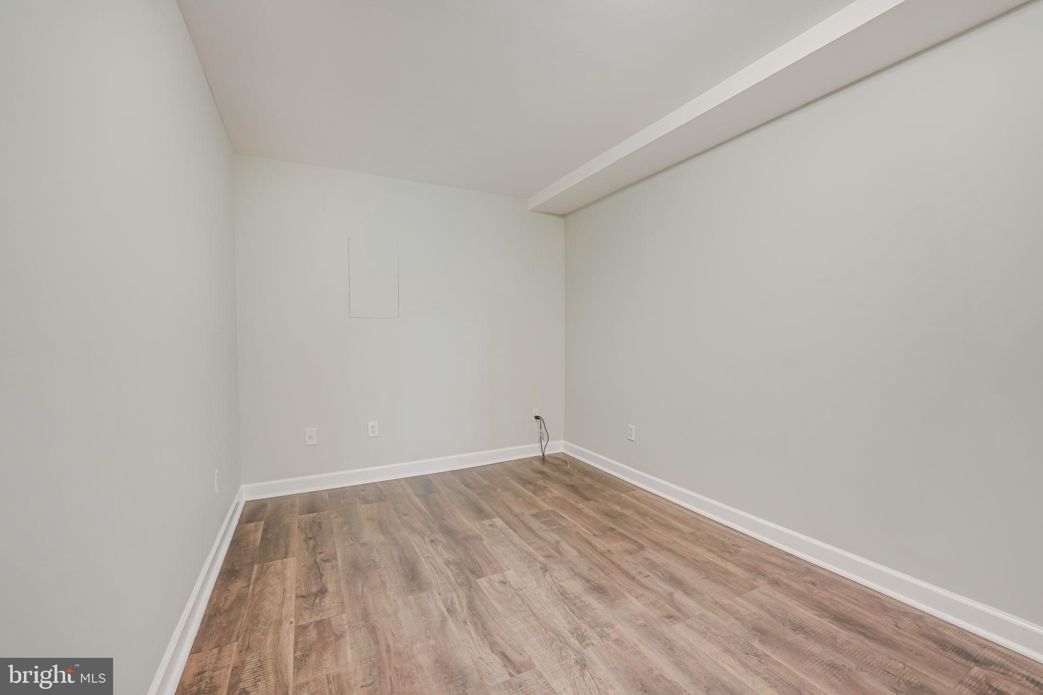 1304 Rittenhouse Street Northwest Washington, DC 20011 - Photo 40 of 50 wooden floor in a empty room