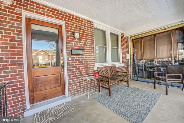 a balcony with furniture and a gate