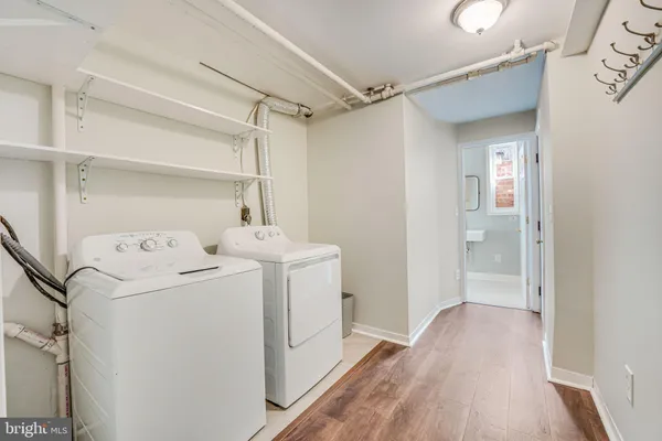 a bathroom with a toilet a sink and a mirror