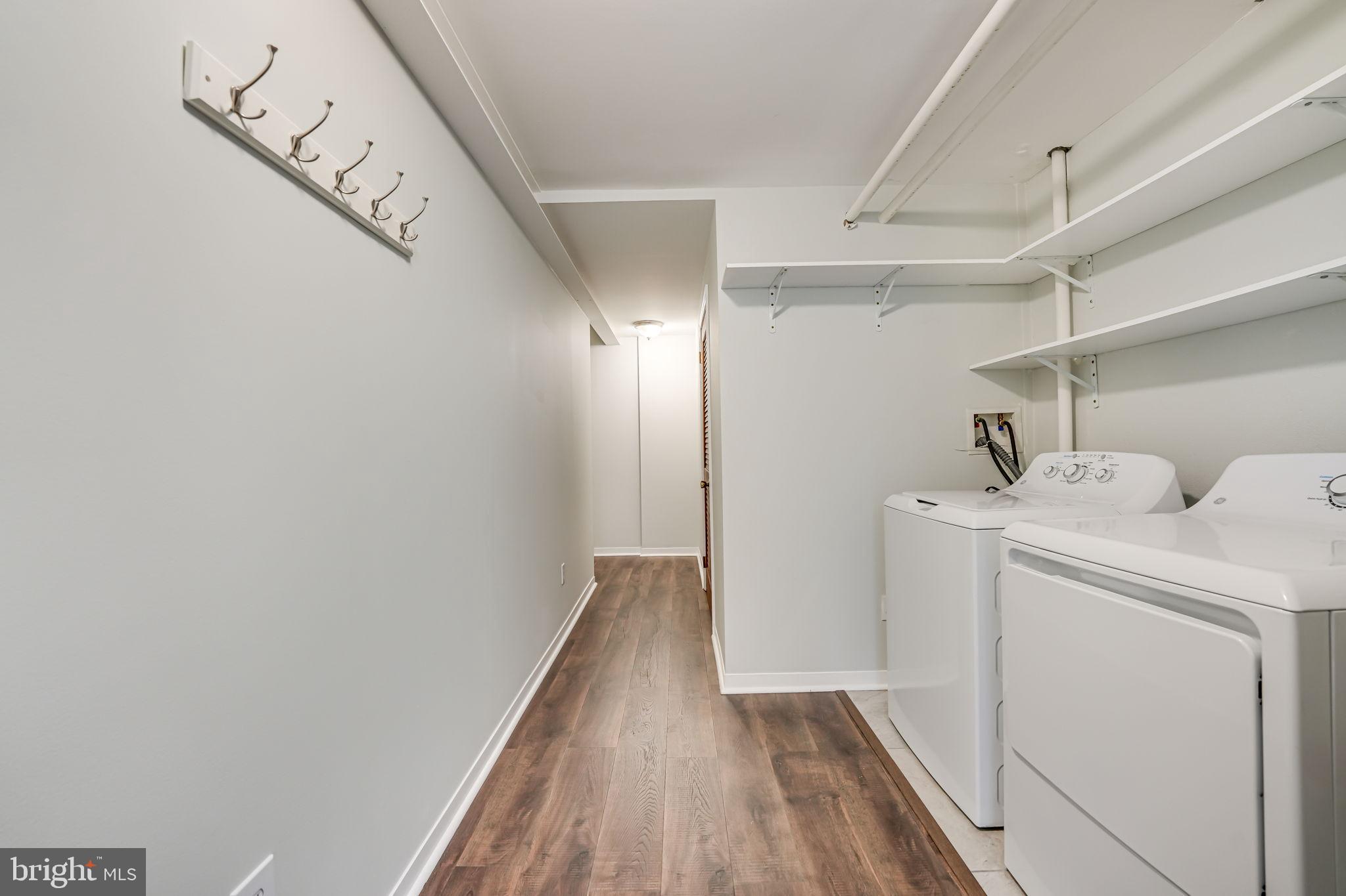 1304 Rittenhouse Street Northwest Washington, DC 20011 - Photo 42 of 50 a view of storage and utility room with washer and dryer