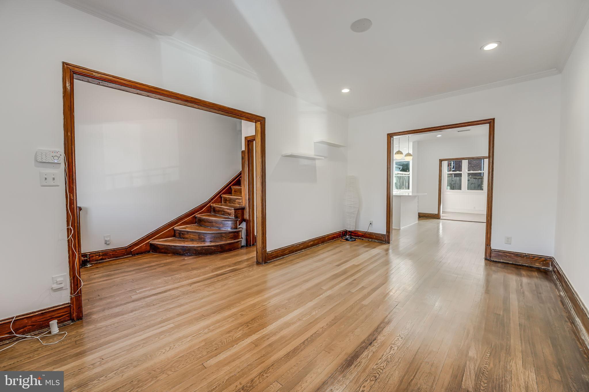 1304 Rittenhouse Street Northwest Washington, DC 20011 - Photo 8 of 50 a view of an empty room with wooden floor