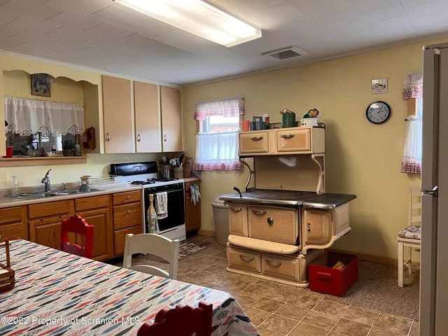 a bedroom with a bed and a television