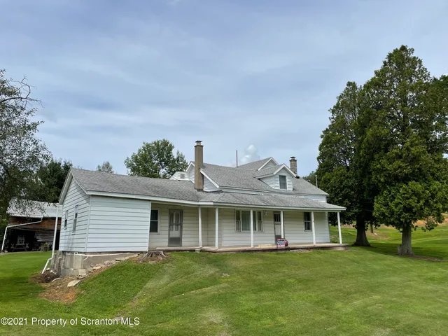 a view of a house with a big yard