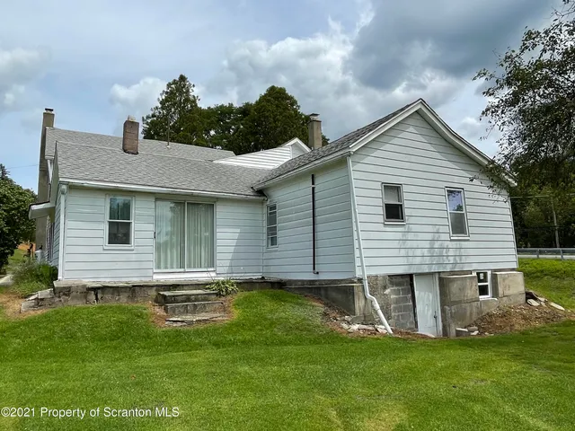 a kitchen with a sink appliances and cabinets
