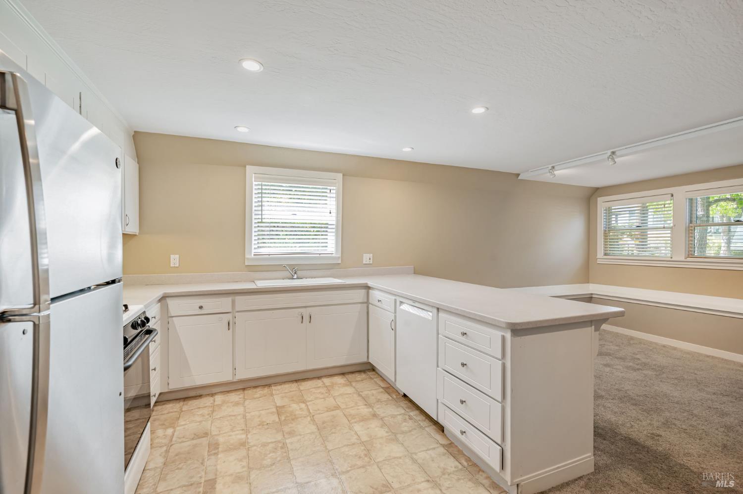 29 Frances Street San Rafael, CA 94901 - Photo 34 of 42 a kitchen with white cabinets and white appliances