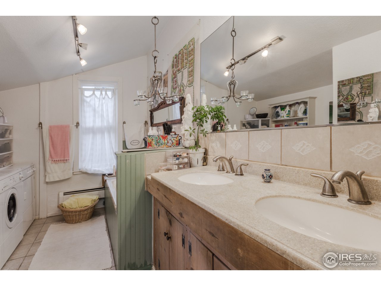 404 East Baseline Road Lafayette, CO 80026 - Photo 17 of 19 a bathroom with a sink double vanity and a mirror