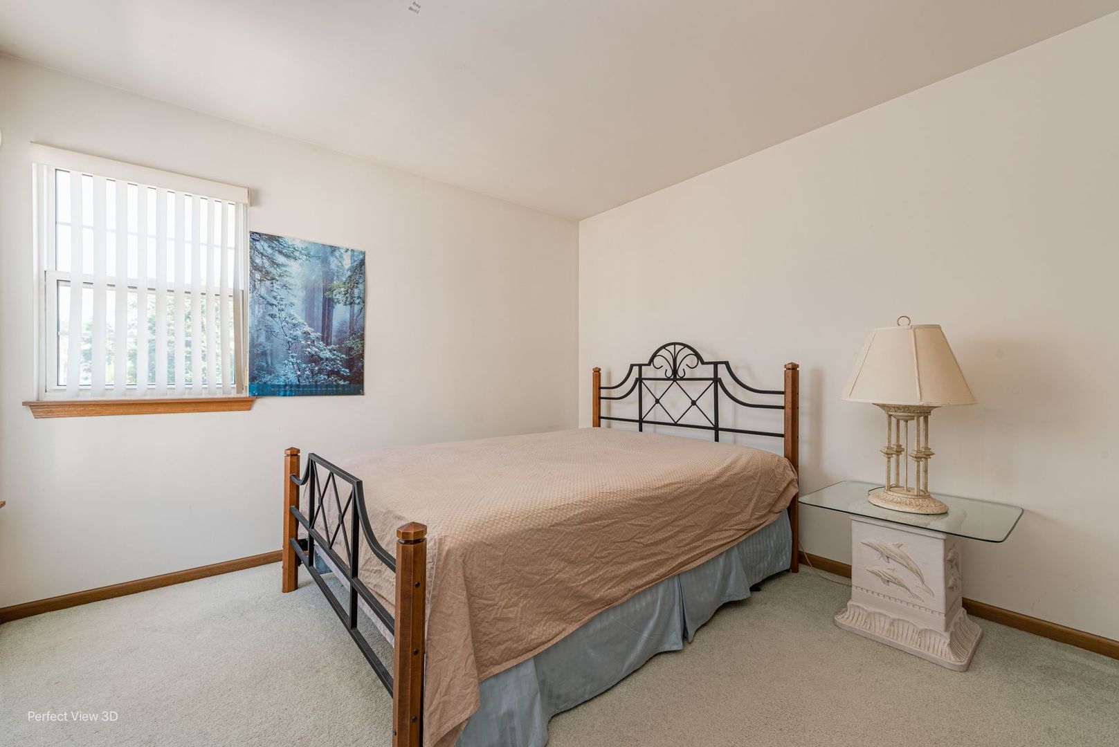 1793 Grove Avenue Schaumburg, IL 60193 - Photo 12 of 16 a bedroom with a bed and a lamp on table