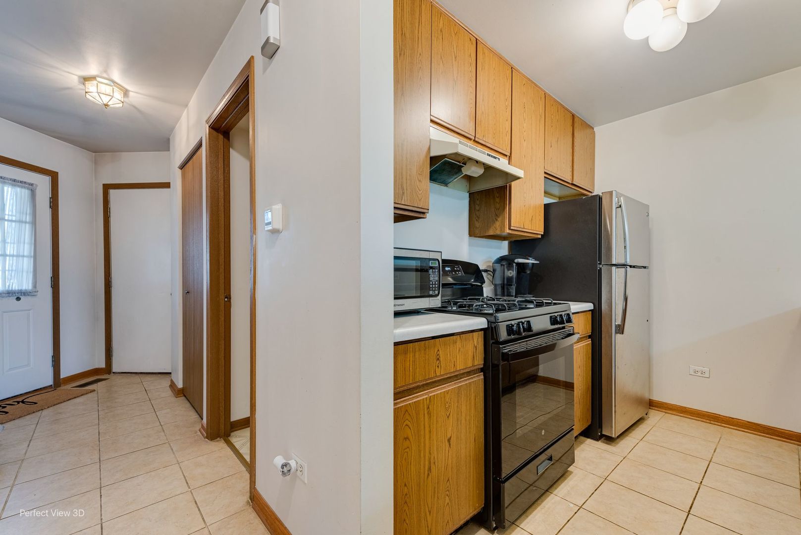 1793 Grove Avenue Schaumburg, IL 60193 - Photo 4 of 16 a kitchen with stainless steel appliances granite countertop a refrigerator and a stove