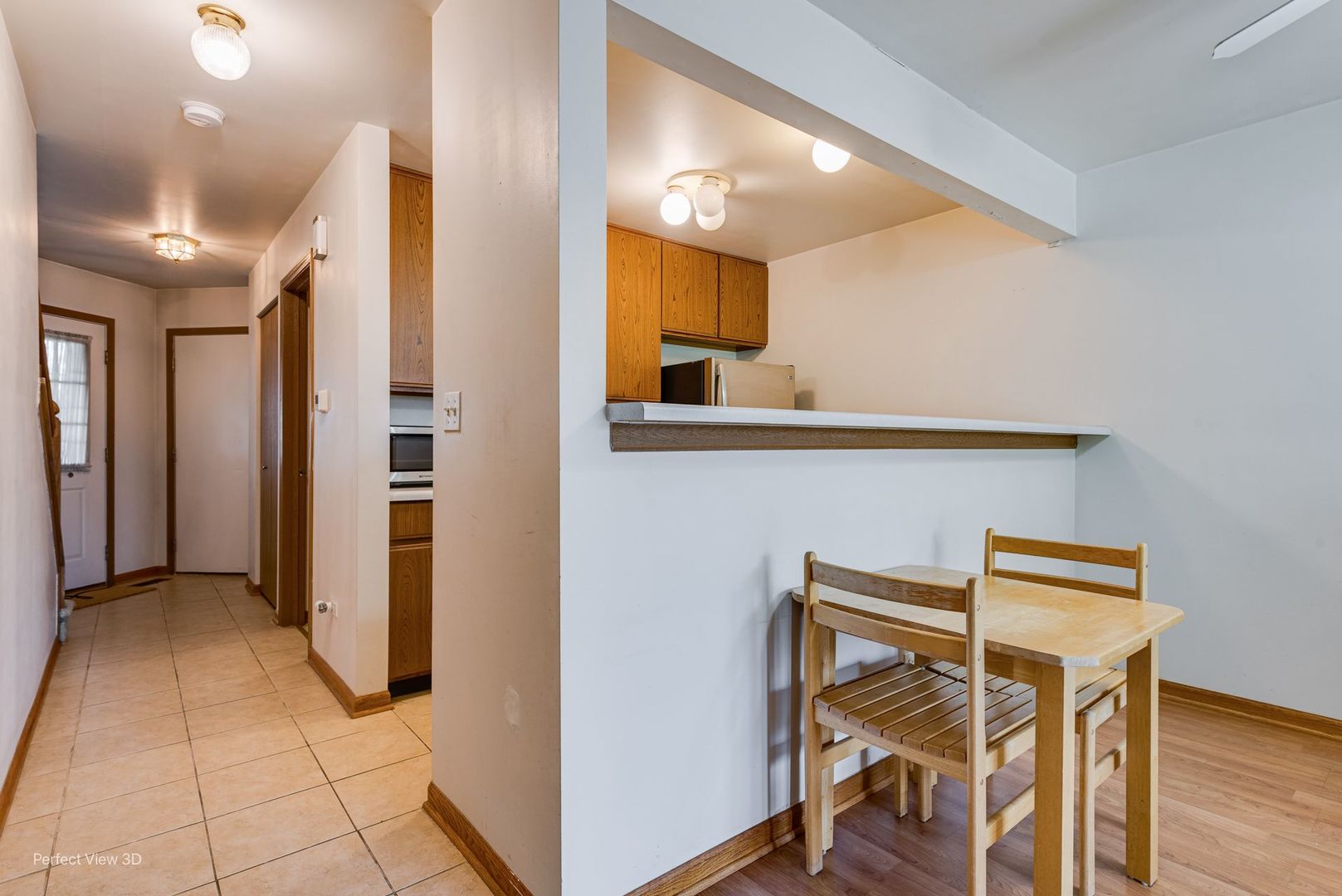 1793 Grove Avenue Schaumburg, IL 60193 - Photo 5 of 16 a view of a hallway with entryway and wooden floor