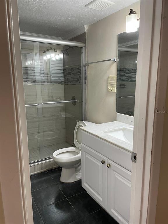 3757 Conroy Road, Unit 2512 Orlando, FL 32839 - Photo 13 of 13 a bathroom with a toilet and a shower