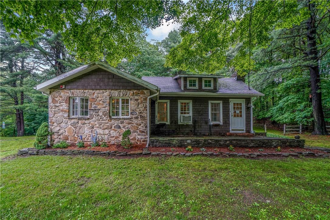 Charming home with 2-3 bedrooms set upon 3.3 acres. Detached garage/barn for storage. Come take a look.
