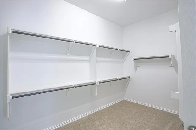 a view of an empty walk in closet