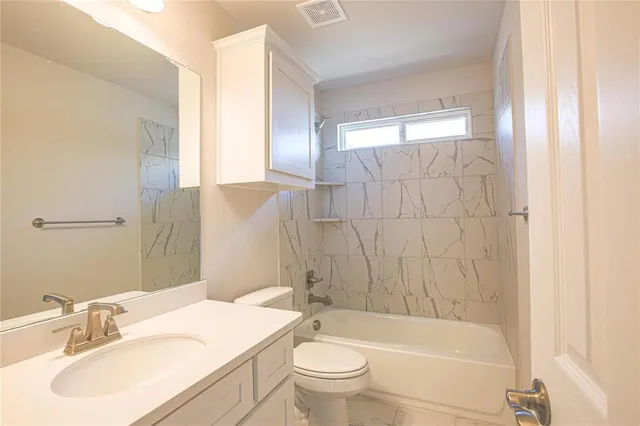 a bathroom with a sink double vanity and a mirror
