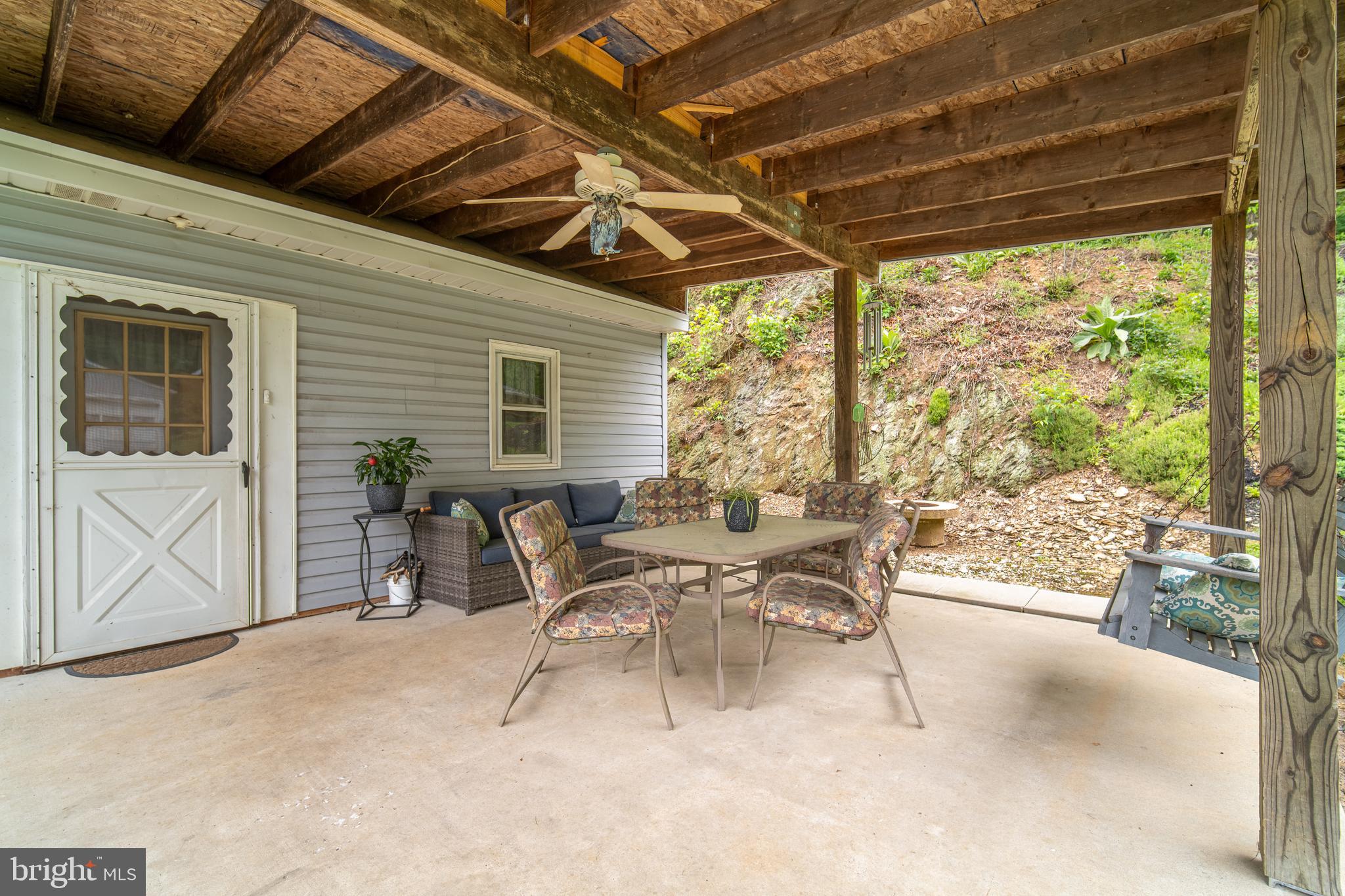 13127 Manor Furnace Road Brogue, PA 17309 - Photo 52 of 78 a view of a patio with table and chairs and potted plants