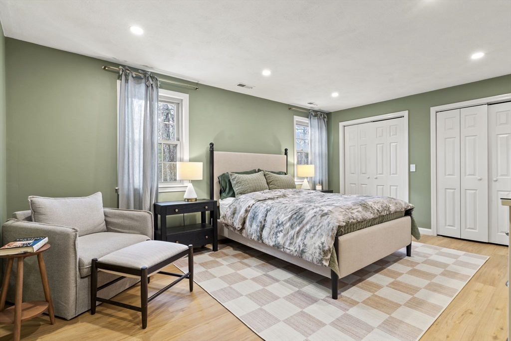 4 Apple Ridge Road, Unit 6 Maynard, MA 01754 - Photo 12 of 40 a bedroom with a bed and a table
