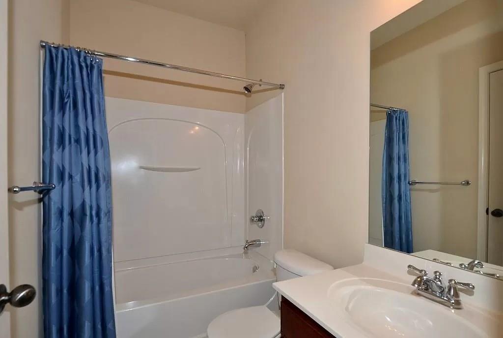 4411 Village Field Place Suwanee, GA 30024 - Photo 6 of 9 a bathroom with a sink toilet and shower