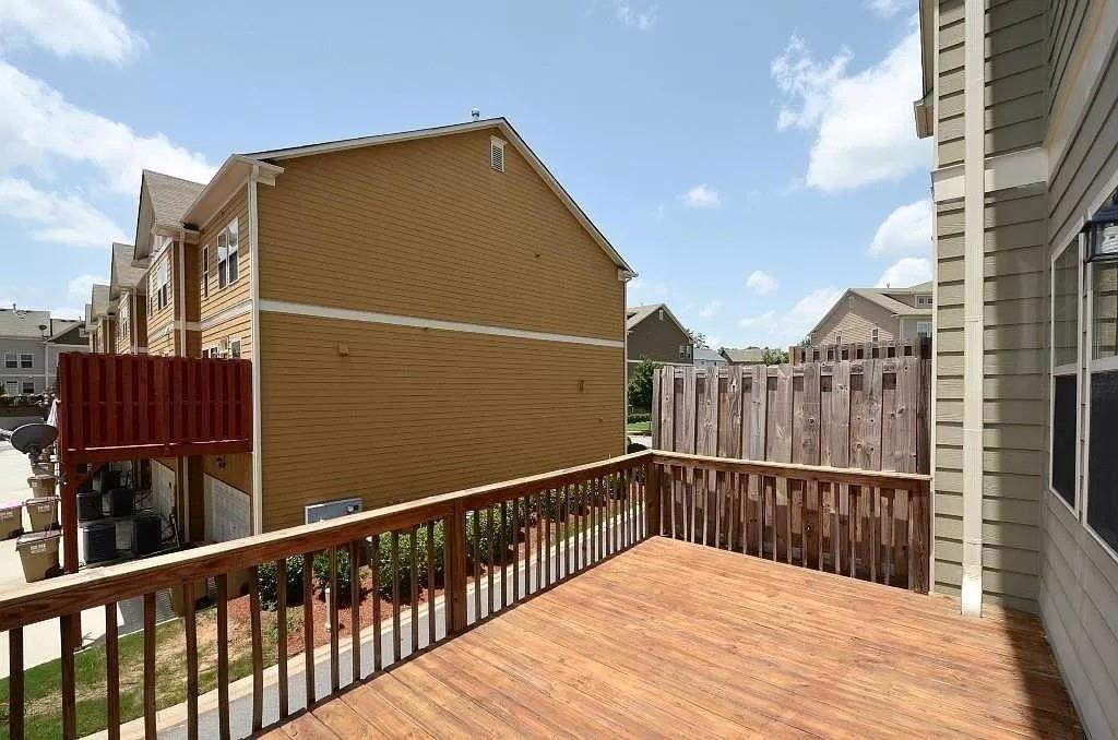 4411 Village Field Place Suwanee, GA 30024 - Photo 8 of 9 a view of balcony with wooden floor