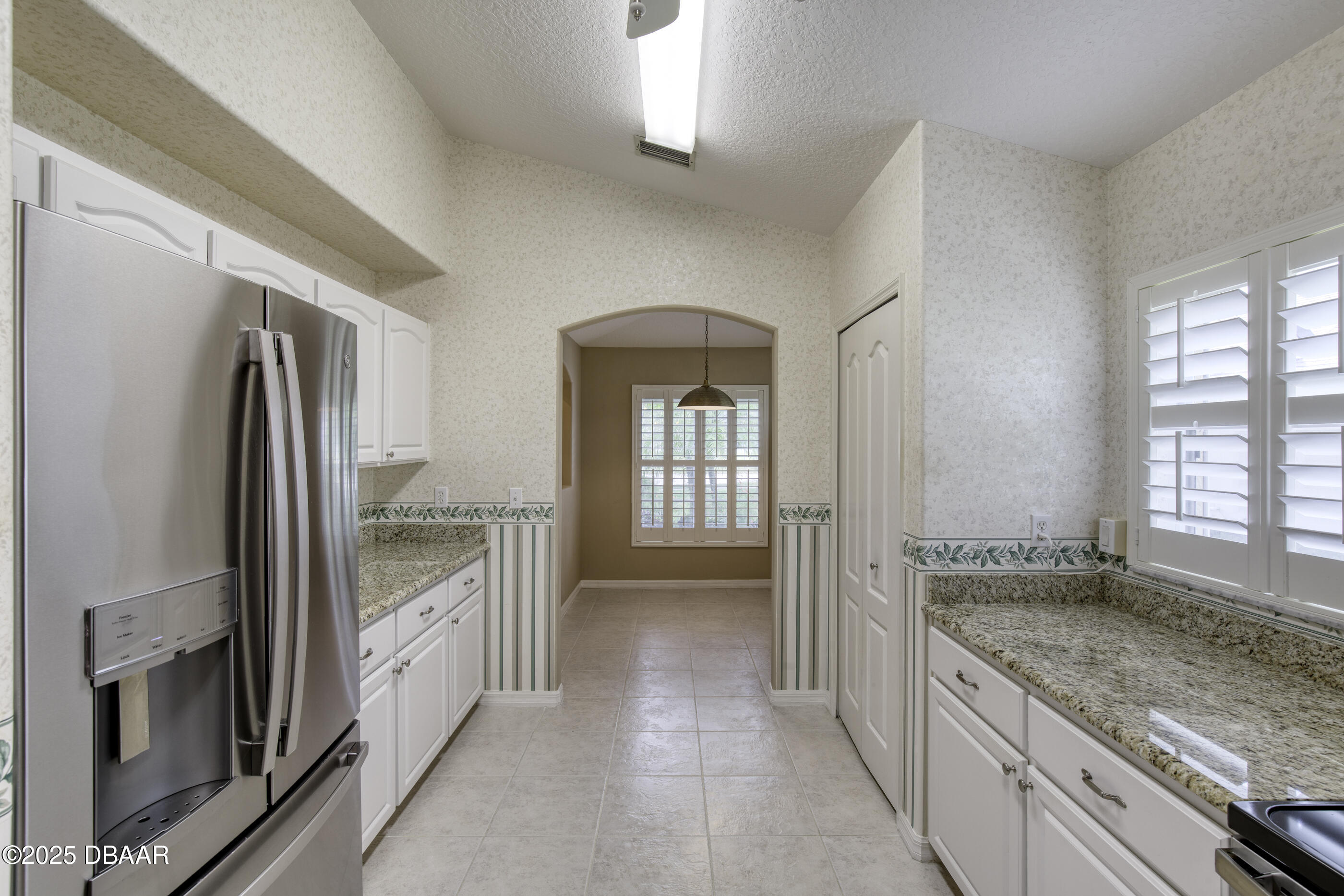 38 Lake Walden Trail Ormond Beach, FL 32174 - Photo 14 of 72 a bathroom with a granite countertop sink and a large mirror