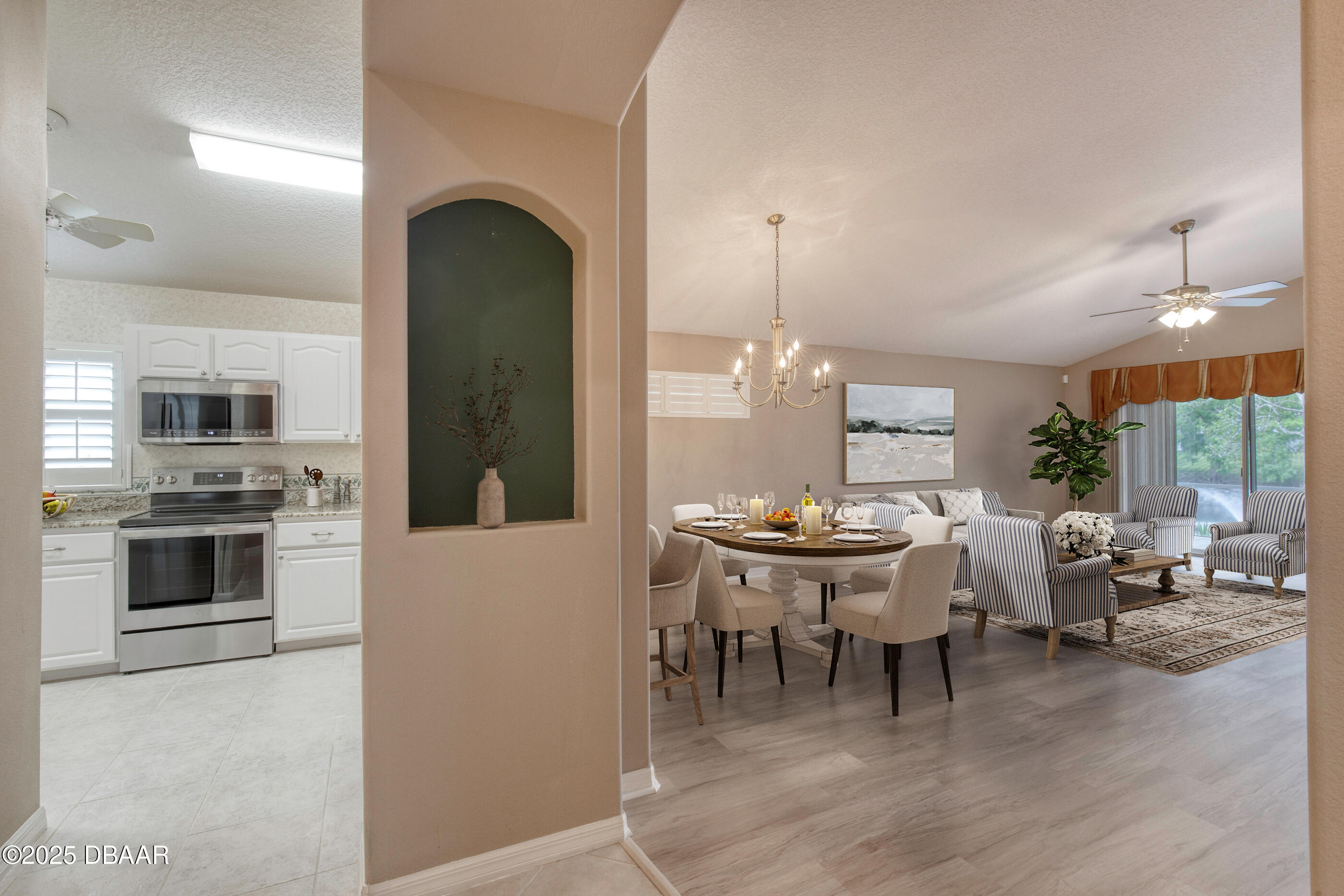 38 Lake Walden Trail Ormond Beach, FL 32174 - Photo 17 of 72 a living room with furniture a fireplace and a dining table with wooden floor