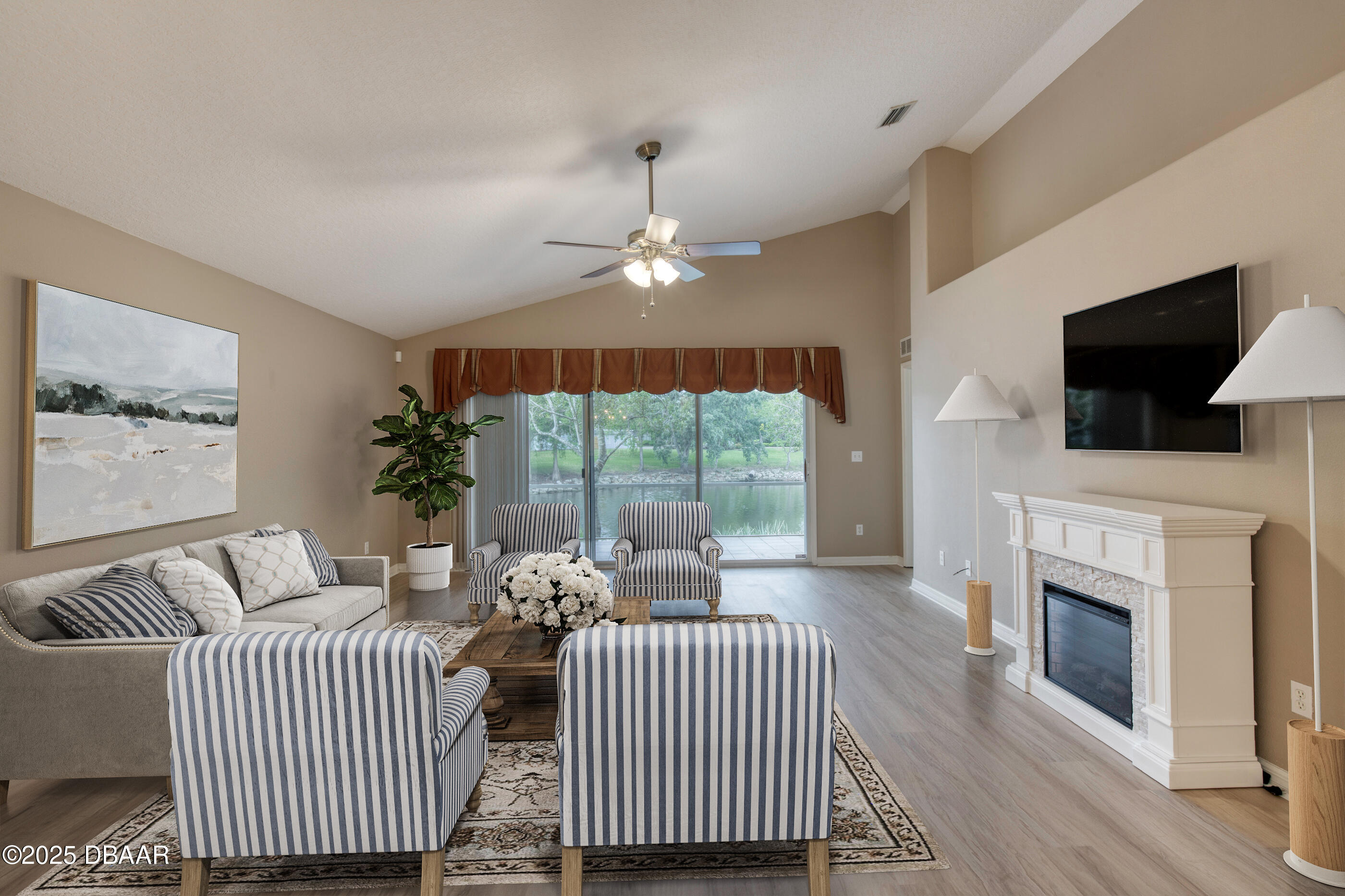 38 Lake Walden Trail Ormond Beach, FL 32174 - Photo 21 of 72 a living room with furniture fireplace and flat screen tv