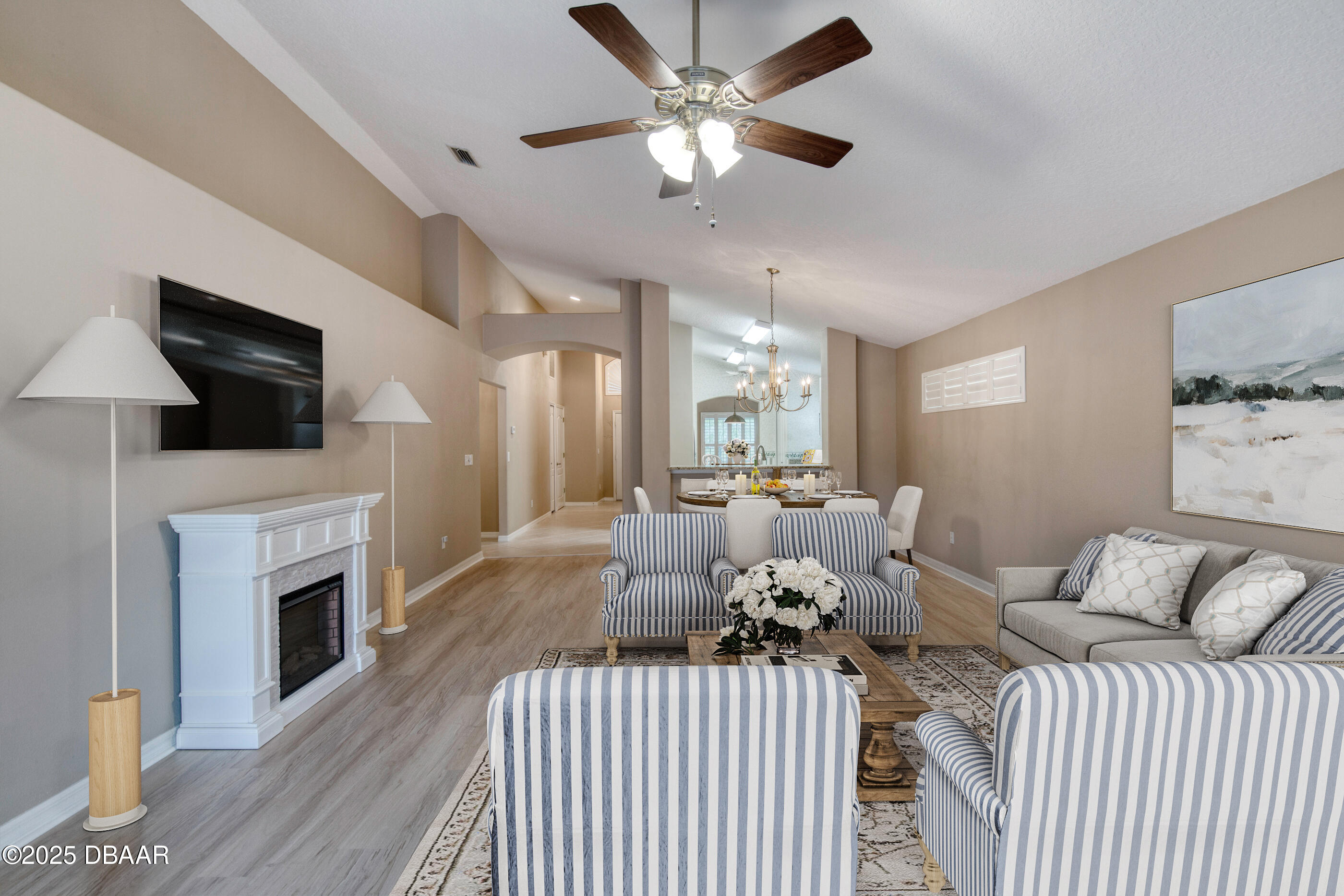 38 Lake Walden Trail Ormond Beach, FL 32174 - Photo 23 of 72 a living room with furniture fireplace and flat screen tv