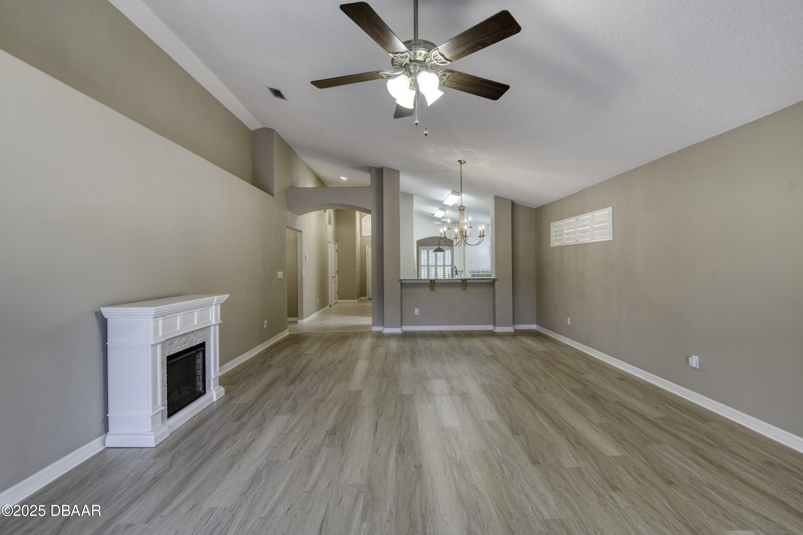 38 Lake Walden Trail Ormond Beach, FL 32174 - Photo 24 of 72 an empty room with wooden floor fan and windows