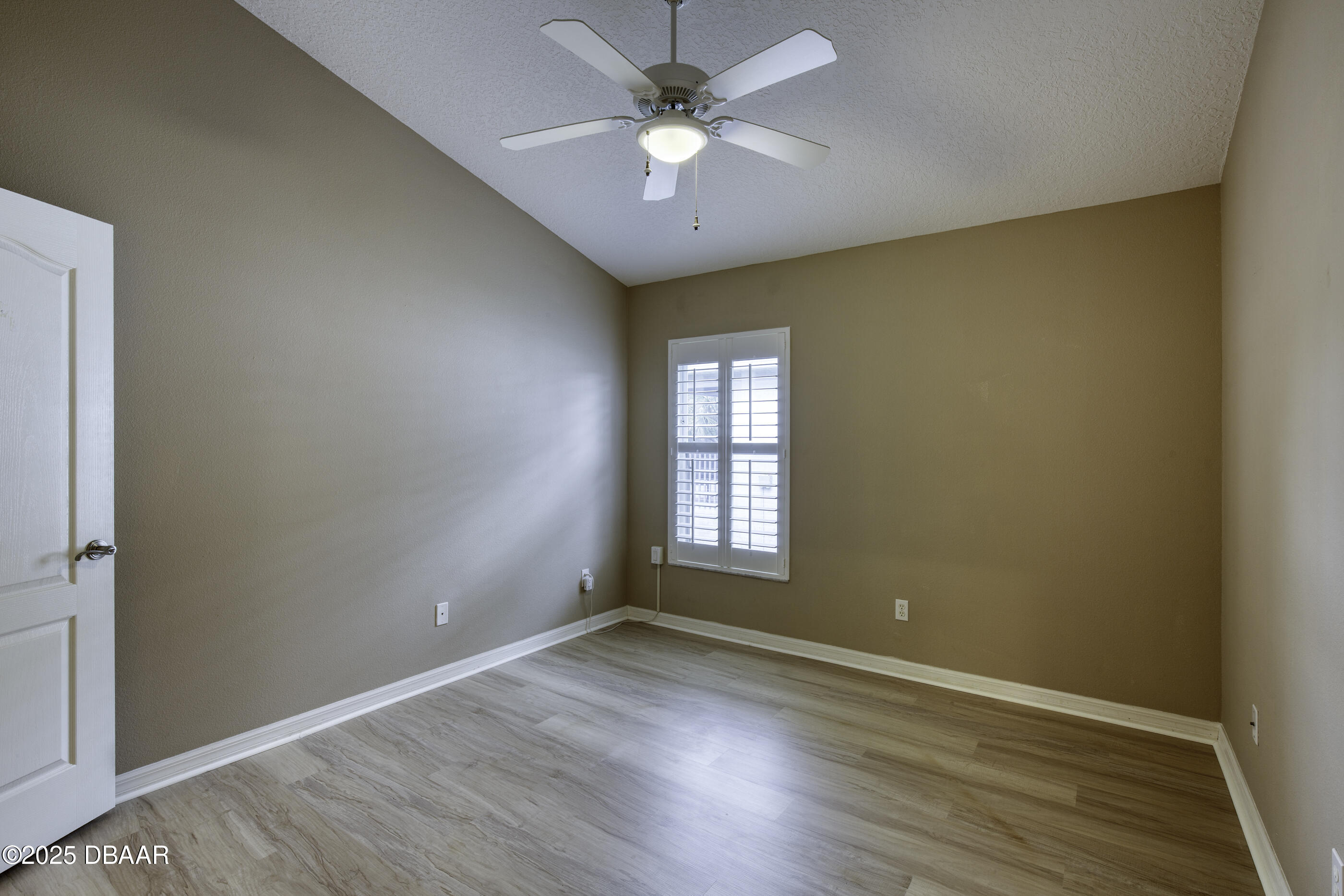38 Lake Walden Trail Ormond Beach, FL 32174 - Photo 26 of 72 an empty room with wooden floor and windows