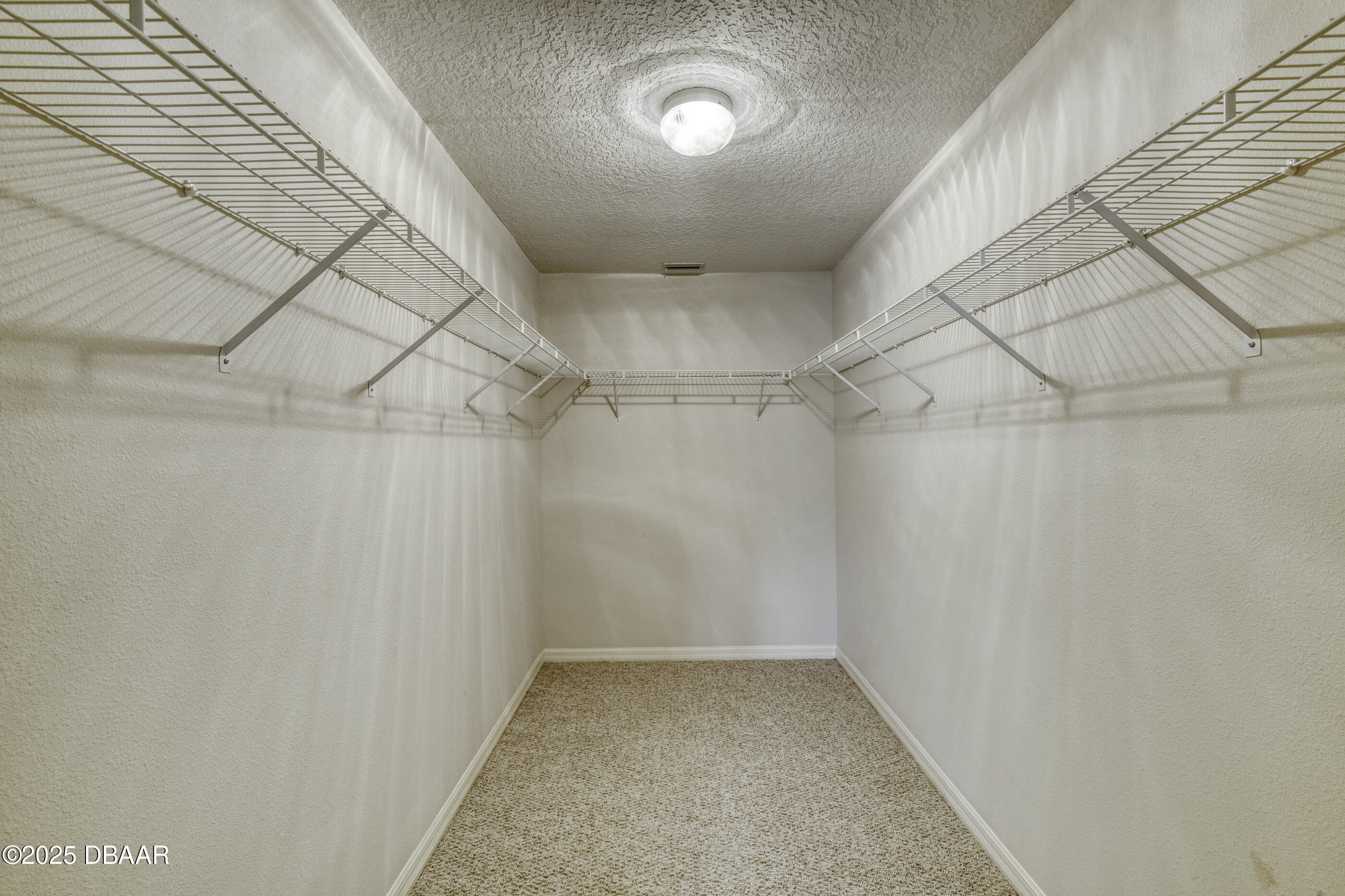 38 Lake Walden Trail Ormond Beach, FL 32174 - Photo 40 of 72 a view of a room with racks on the wall