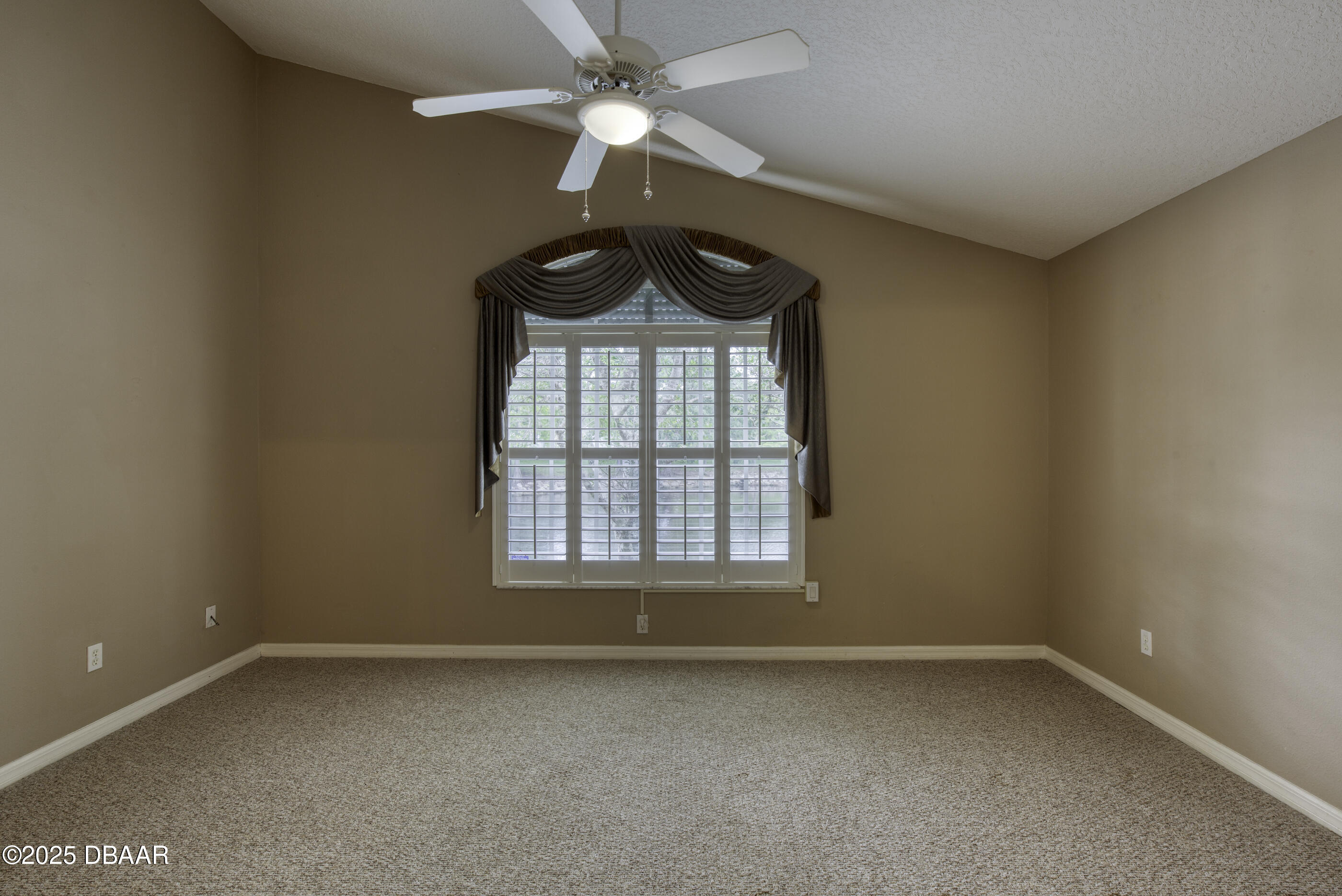 38 Lake Walden Trail Ormond Beach, FL 32174 - Photo 42 of 72 an empty room with a window and a fan