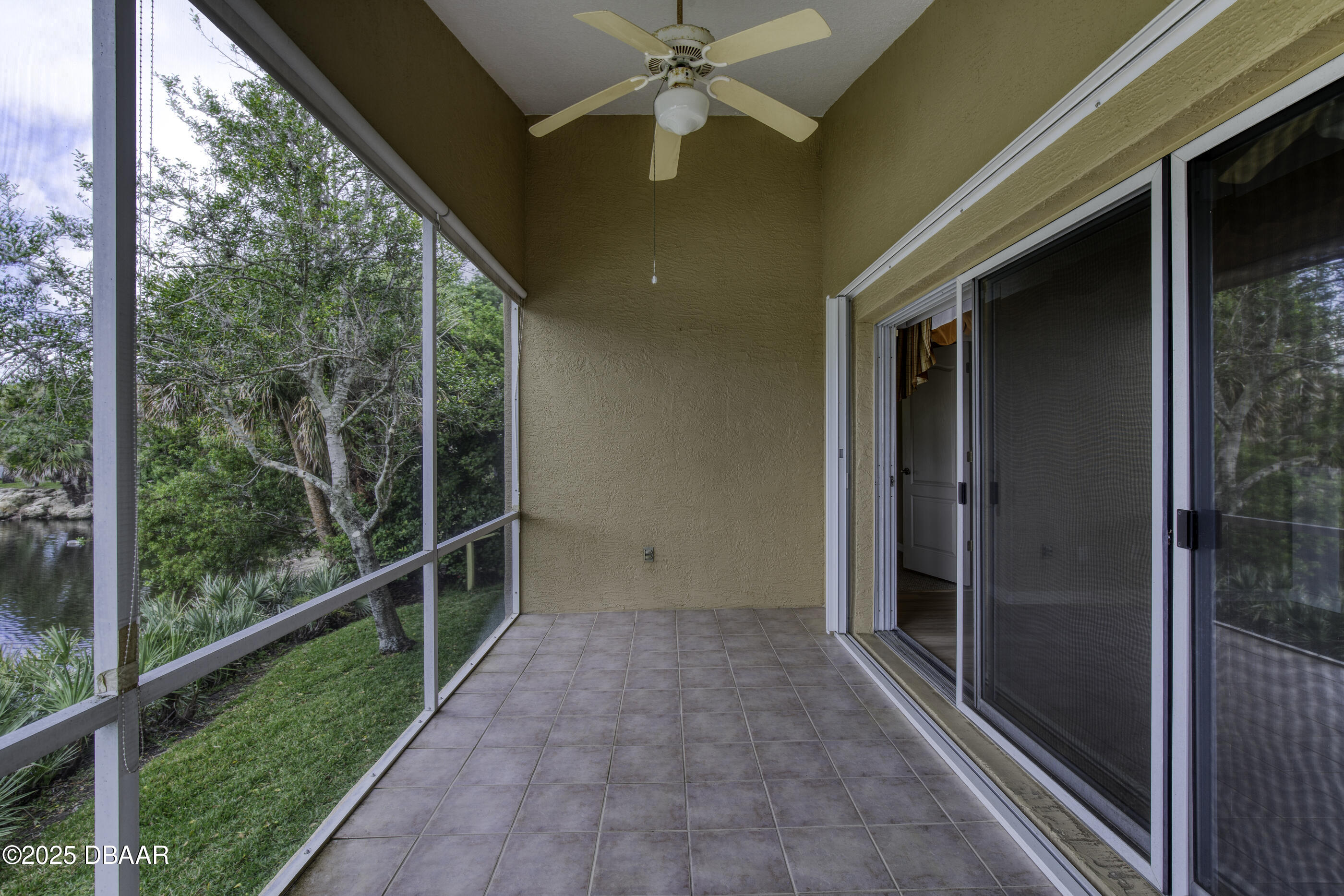 38 Lake Walden Trail Ormond Beach, FL 32174 - Photo 48 of 72 a view of a porch with a floor to ceiling window and a yard
