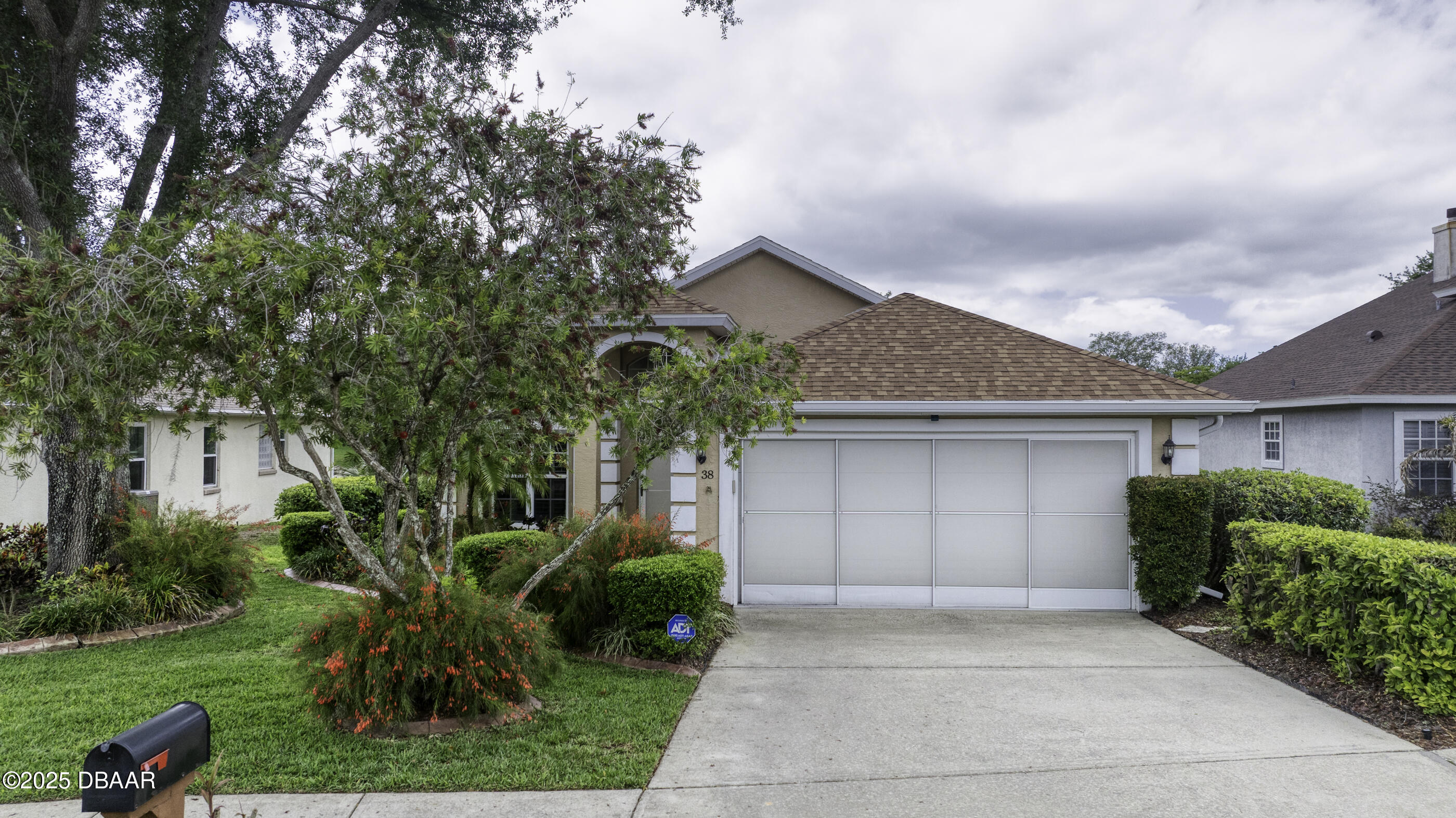 38 Lake Walden Trail Ormond Beach, FL 32174 - Photo 55 of 72 a house view with a garden space
