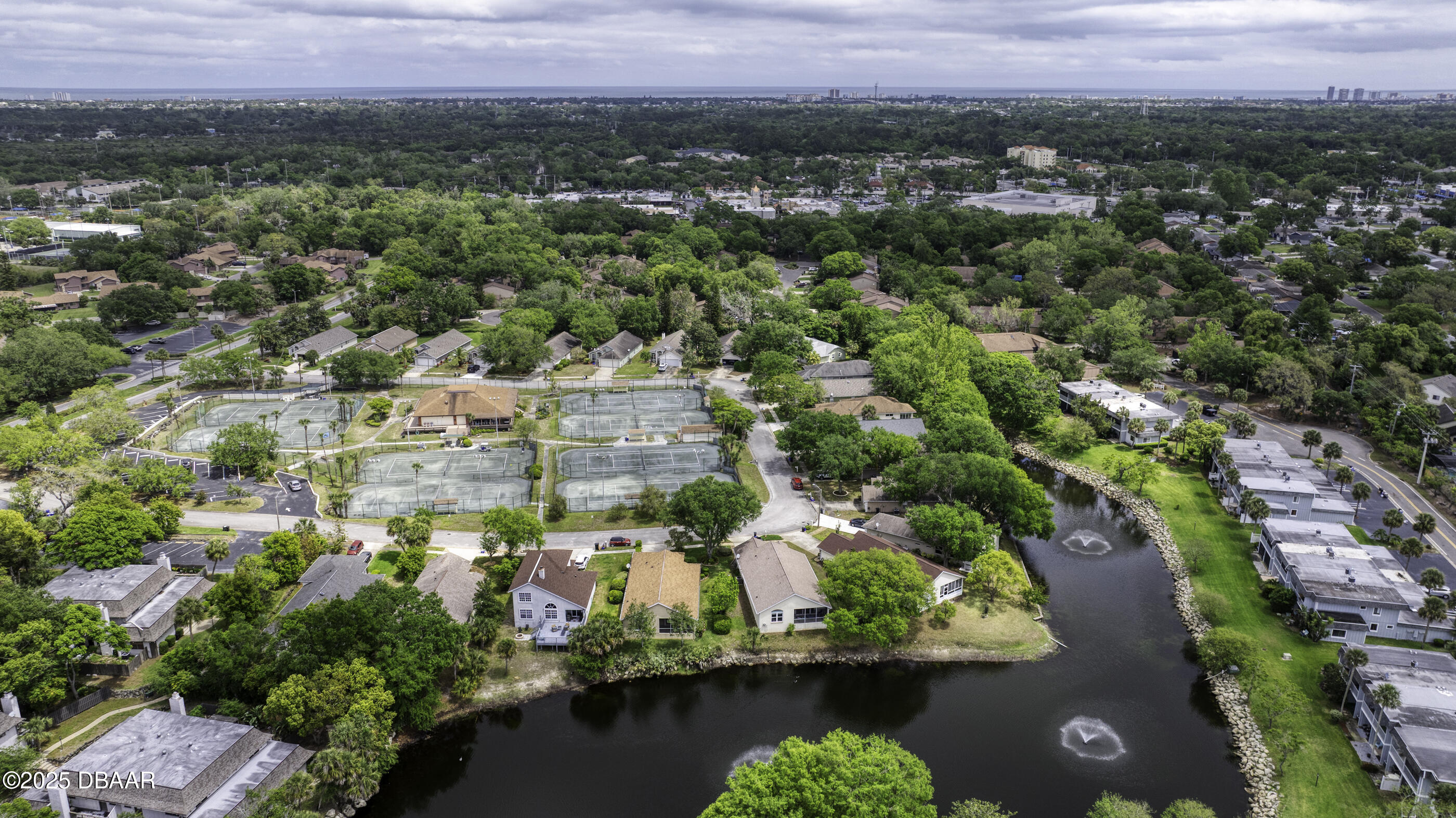 38 Lake Walden Trail Ormond Beach, FL 32174 - Photo 67 of 72 an aerial view of residential houses with outdoor space and trees