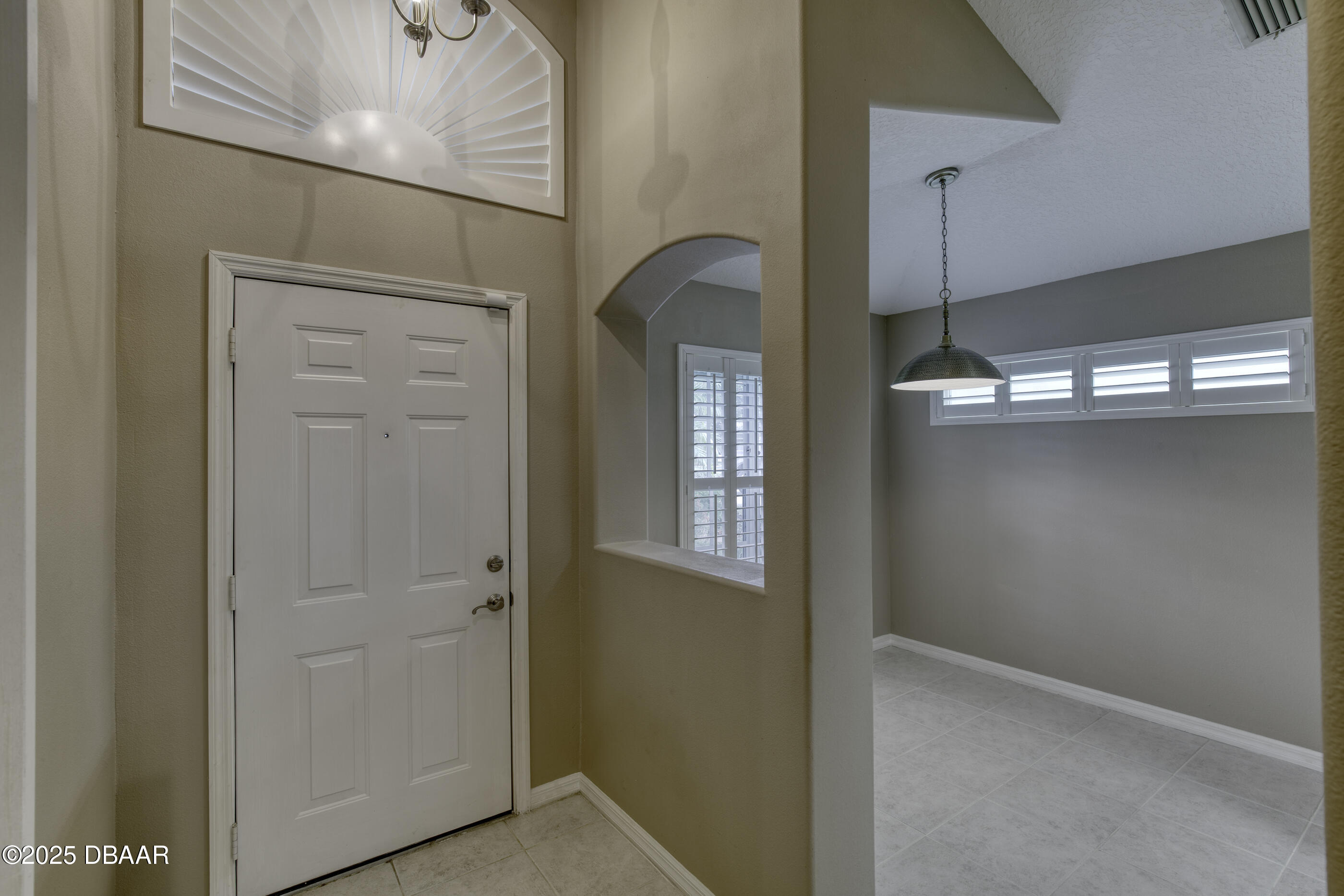 38 Lake Walden Trail Ormond Beach, FL 32174 - Photo 7 of 72 a view of a hallway with front door