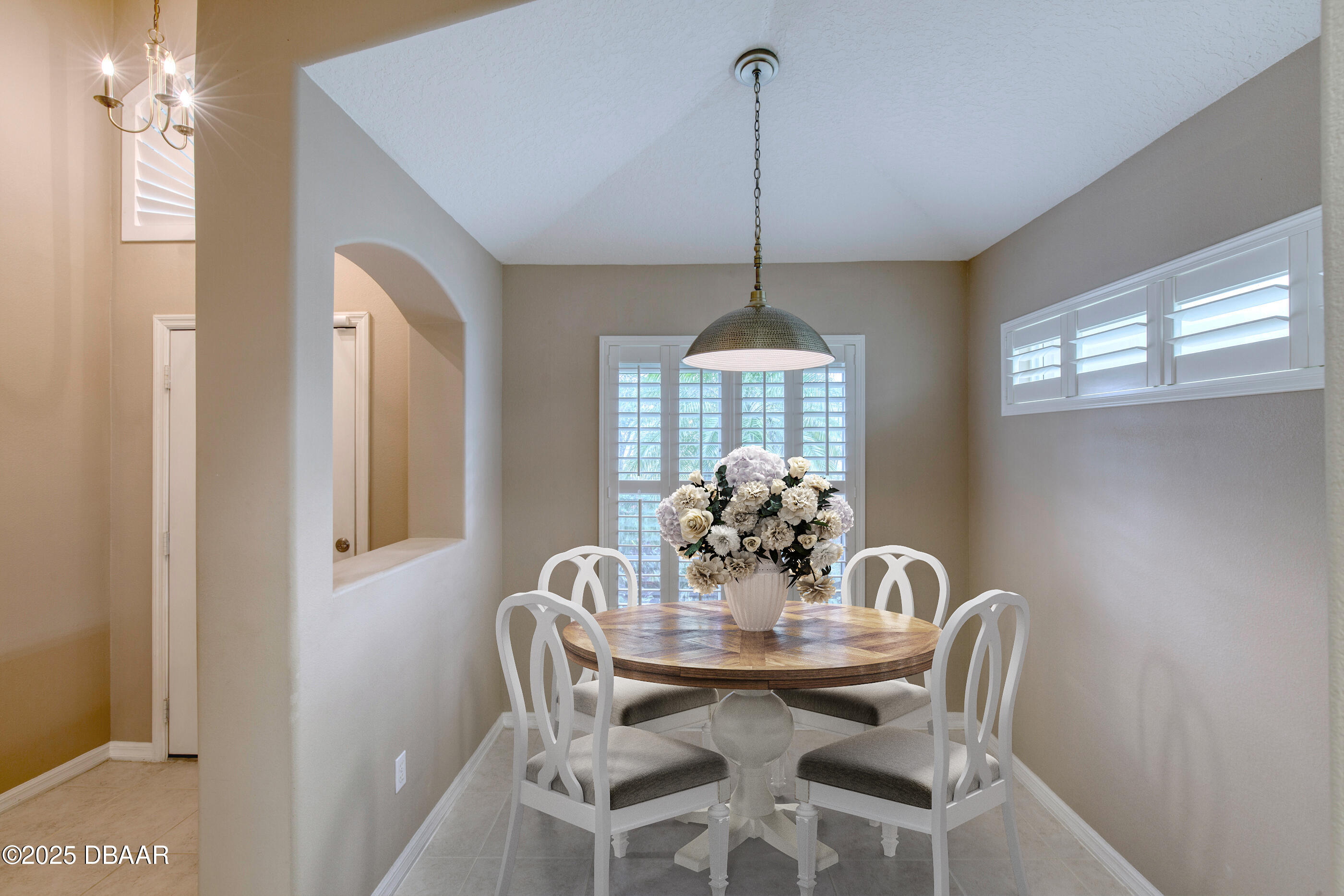 38 Lake Walden Trail Ormond Beach, FL 32174 - Photo 9 of 72 a view of a dining room with furniture and chandelier