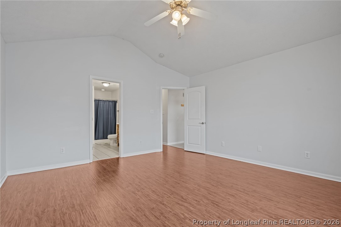 115 Shelby Street Spring Lake, NC 28390 - Photo 23 of 40 a view of an empty room with wooden floor