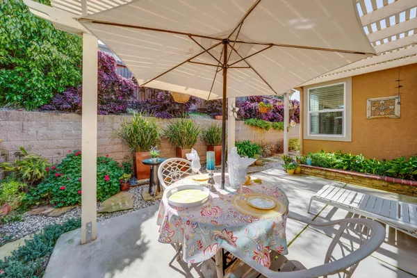 a view of yard with patio