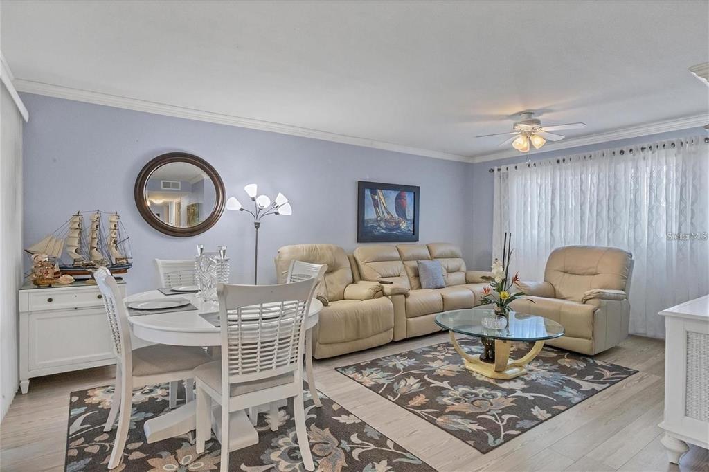 460 Base Avenue East, Unit 113 Venice, FL 34285 - Photo 25 of 25 a living room with furniture a rug and a window