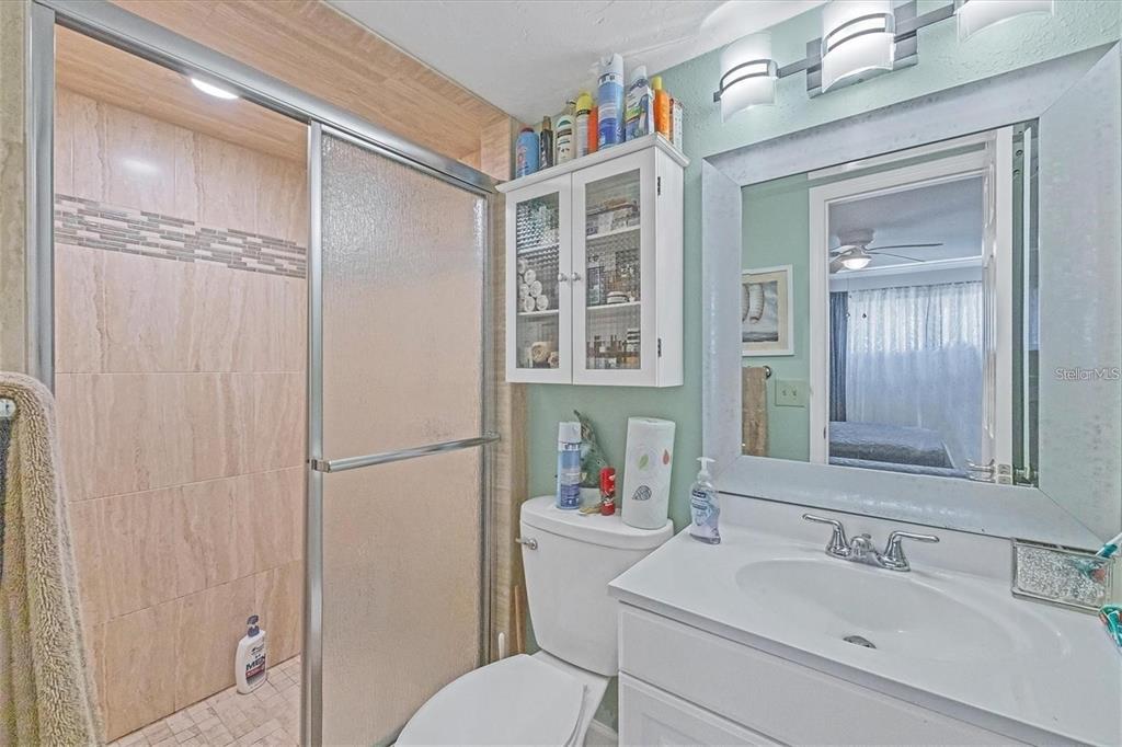 460 Base Avenue East, Unit 113 Venice, FL 34285 - Photo 8 of 25 a bathroom with a sink toilet and shower