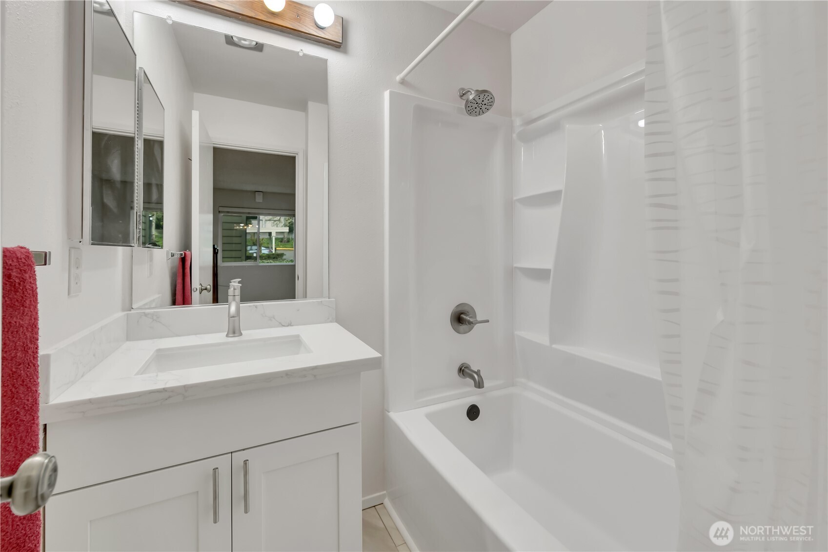 7339 Old Redmond Road, Unit 118 Redmond, WA 98052 - Photo 19 of 25 a white bath tub sitting next to a white sink