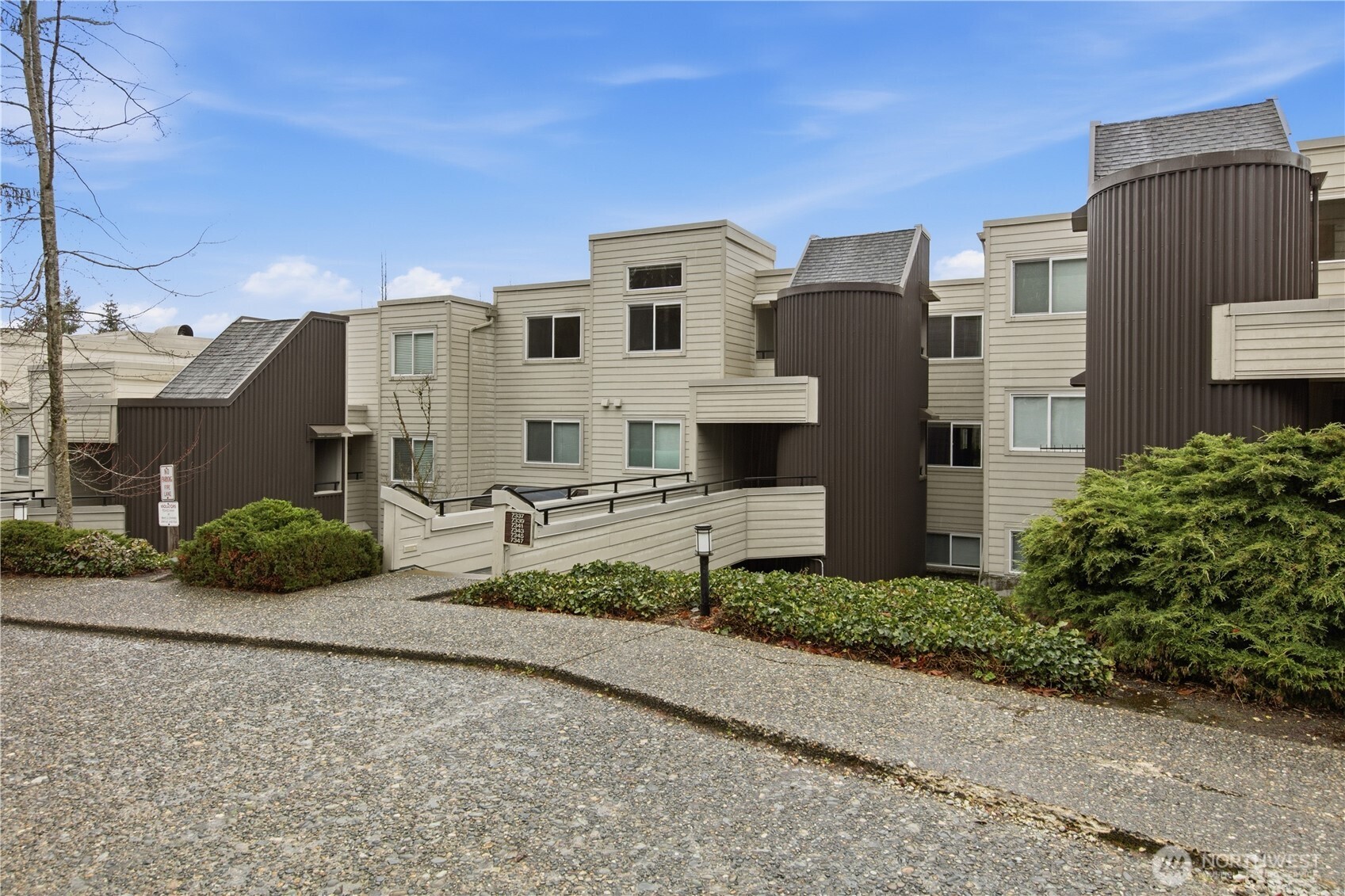 7339 Old Redmond Road, Unit 118 Redmond, WA 98052 - Photo 2 of 25 a front view of a house with a yard and garage