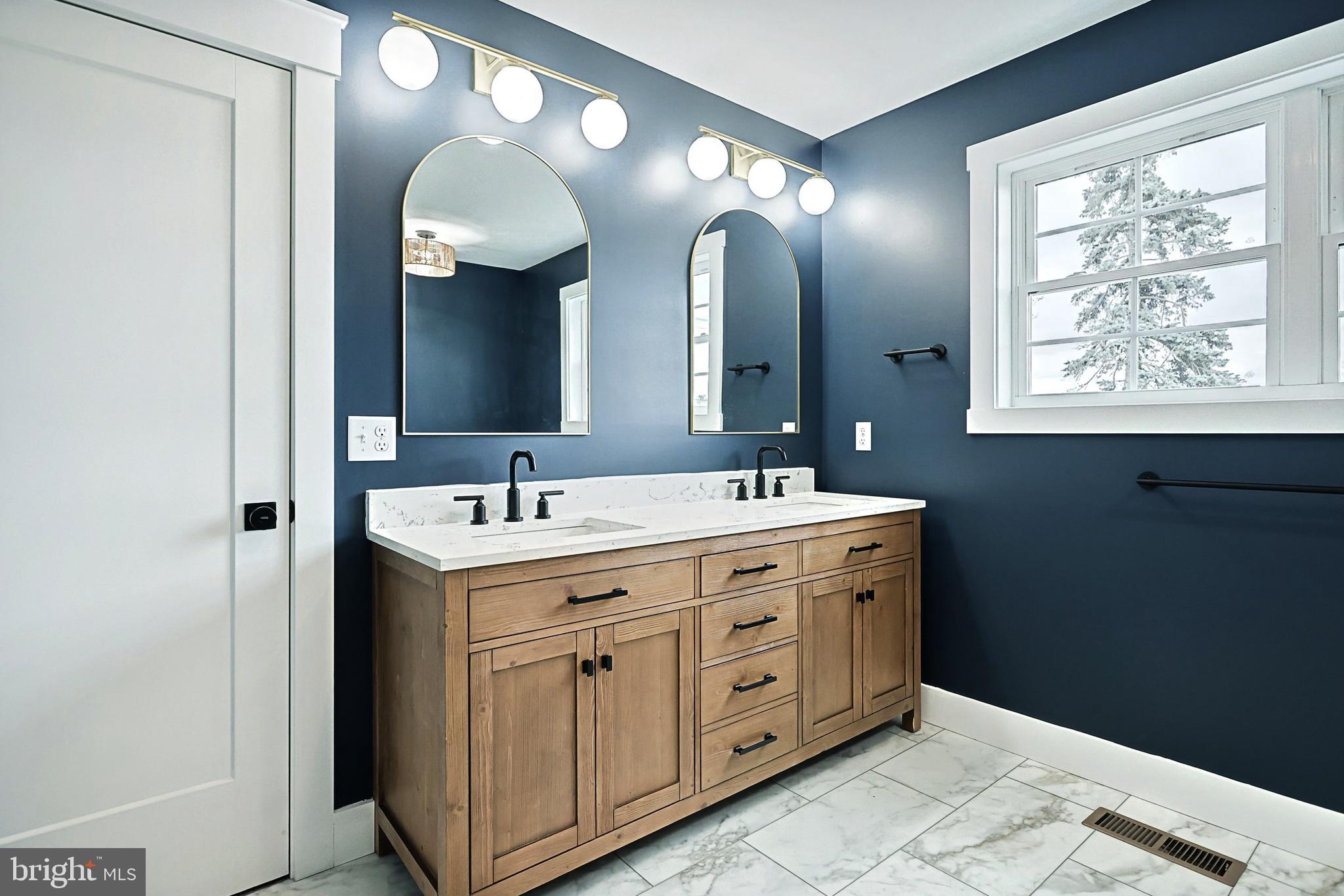 0 Sawmill Road Stewartstown, PA 17363 - Photo 22 of 37 a bathroom with a double vanity sink and a mirror